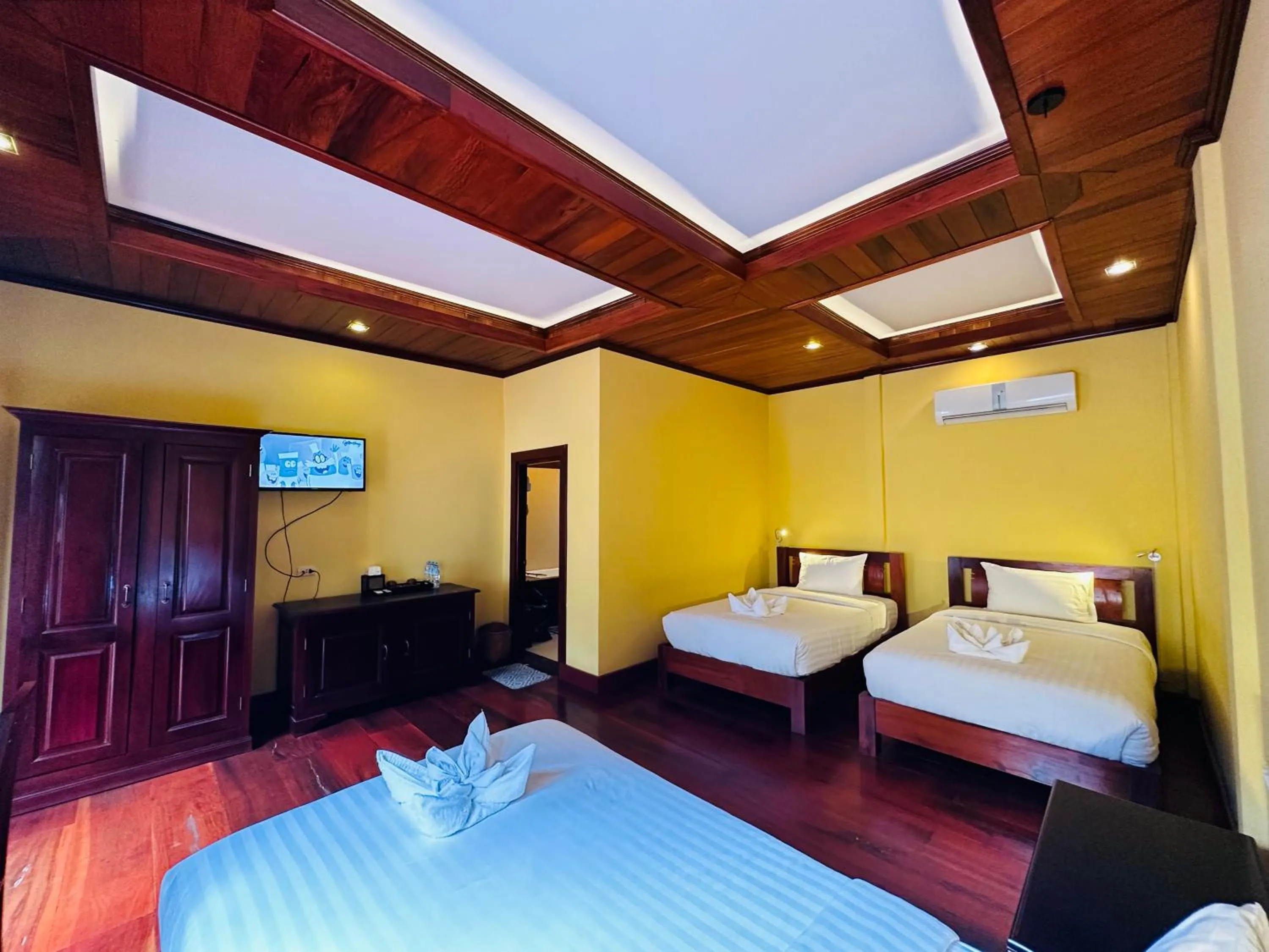 Bed in Villa Phonethip Mekong Riverside