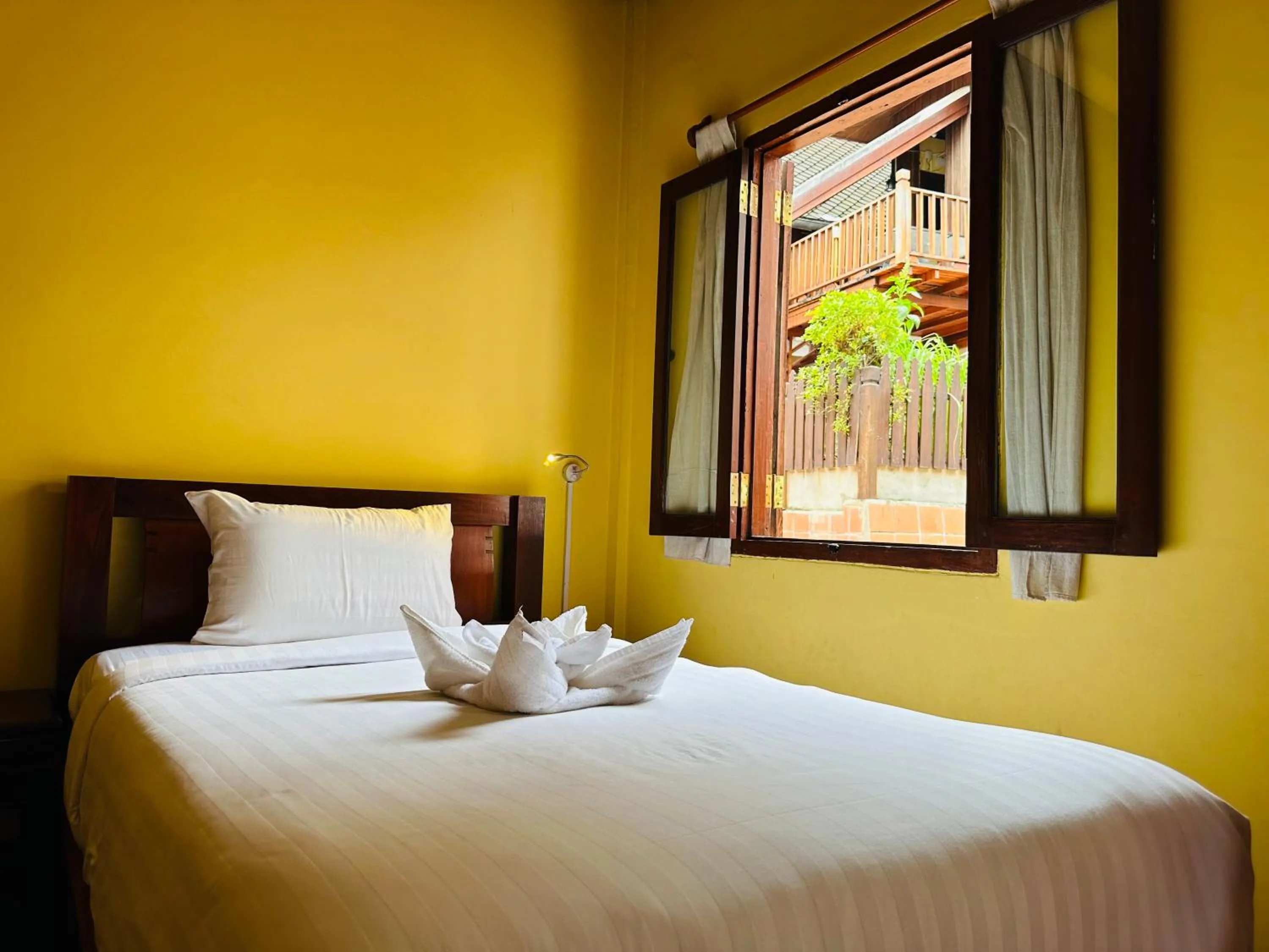 Bed in Villa Phonethip Mekong Riverside