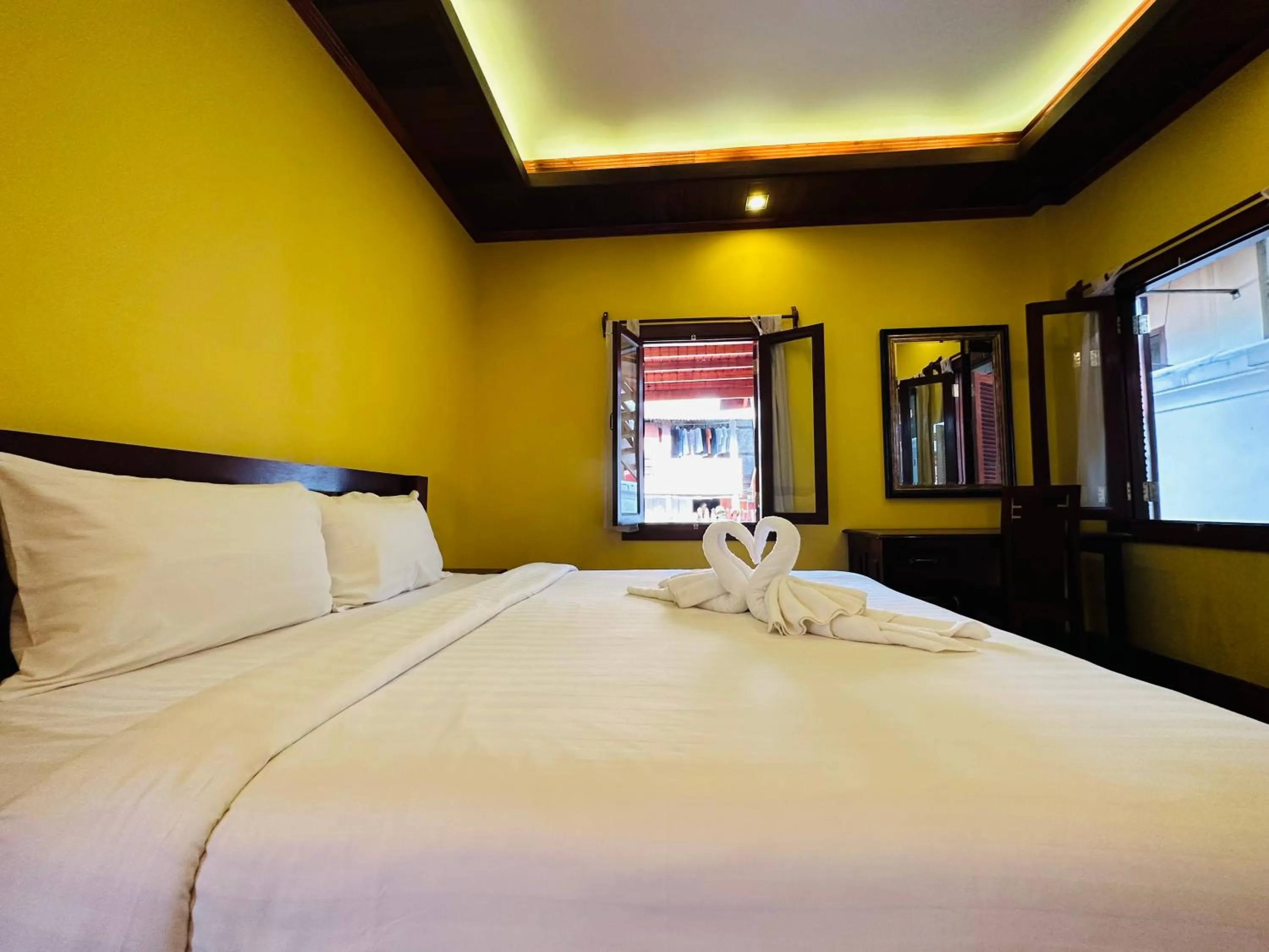 Bed in Villa Phonethip Mekong Riverside