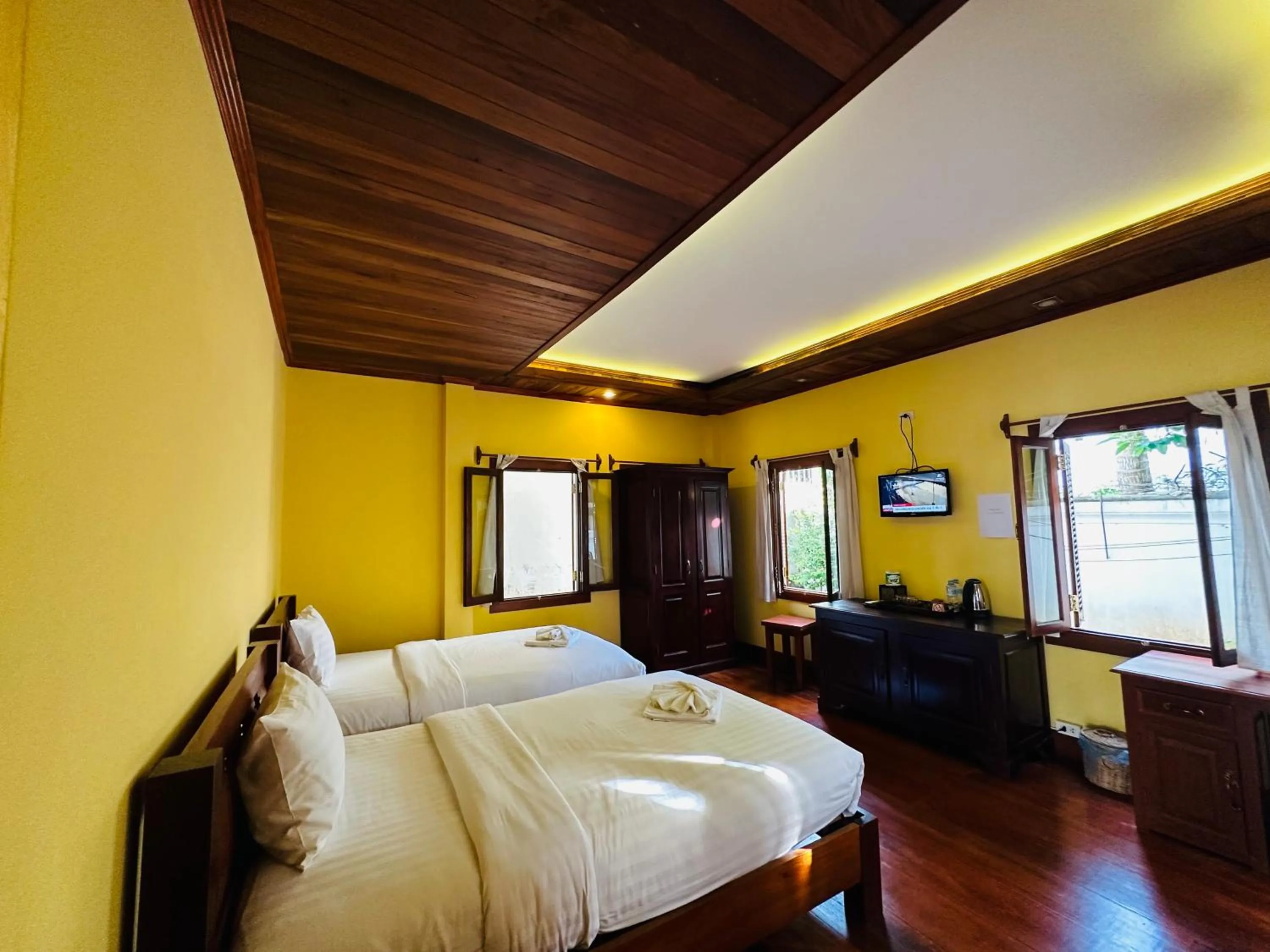 Bed in Villa Phonethip Mekong Riverside