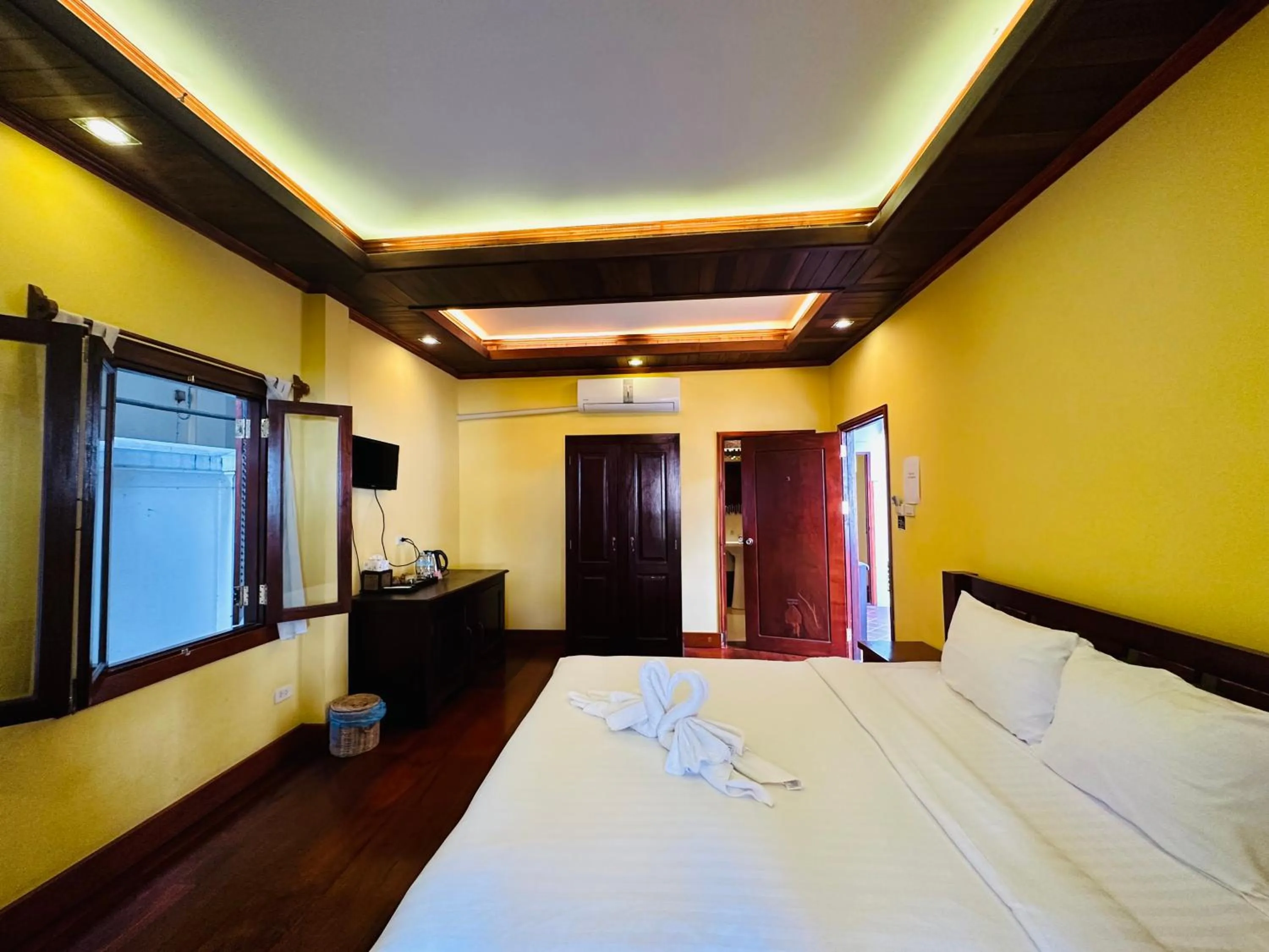 Bed in Villa Phonethip Mekong Riverside