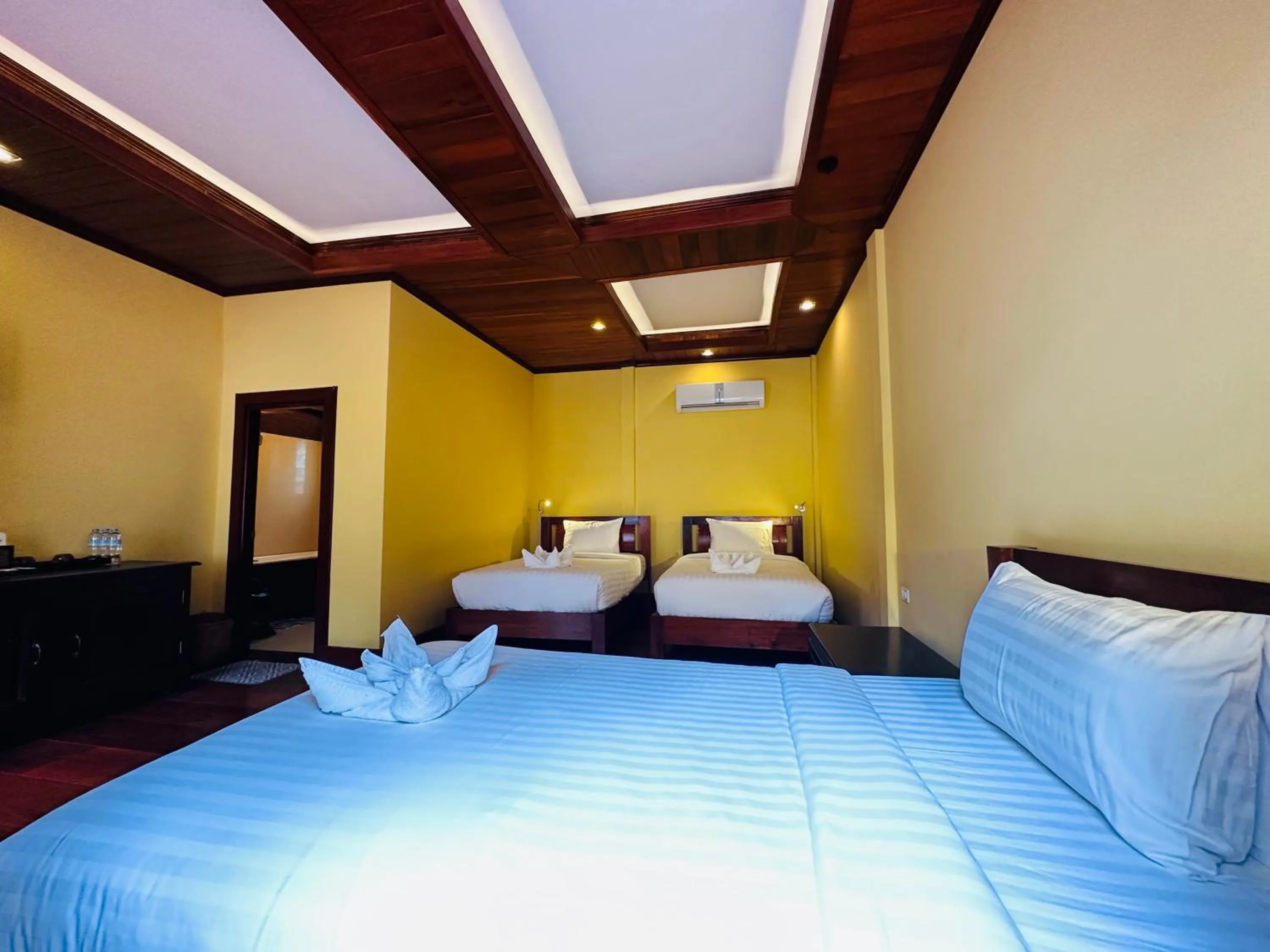 Bed in Villa Phonethip Mekong Riverside