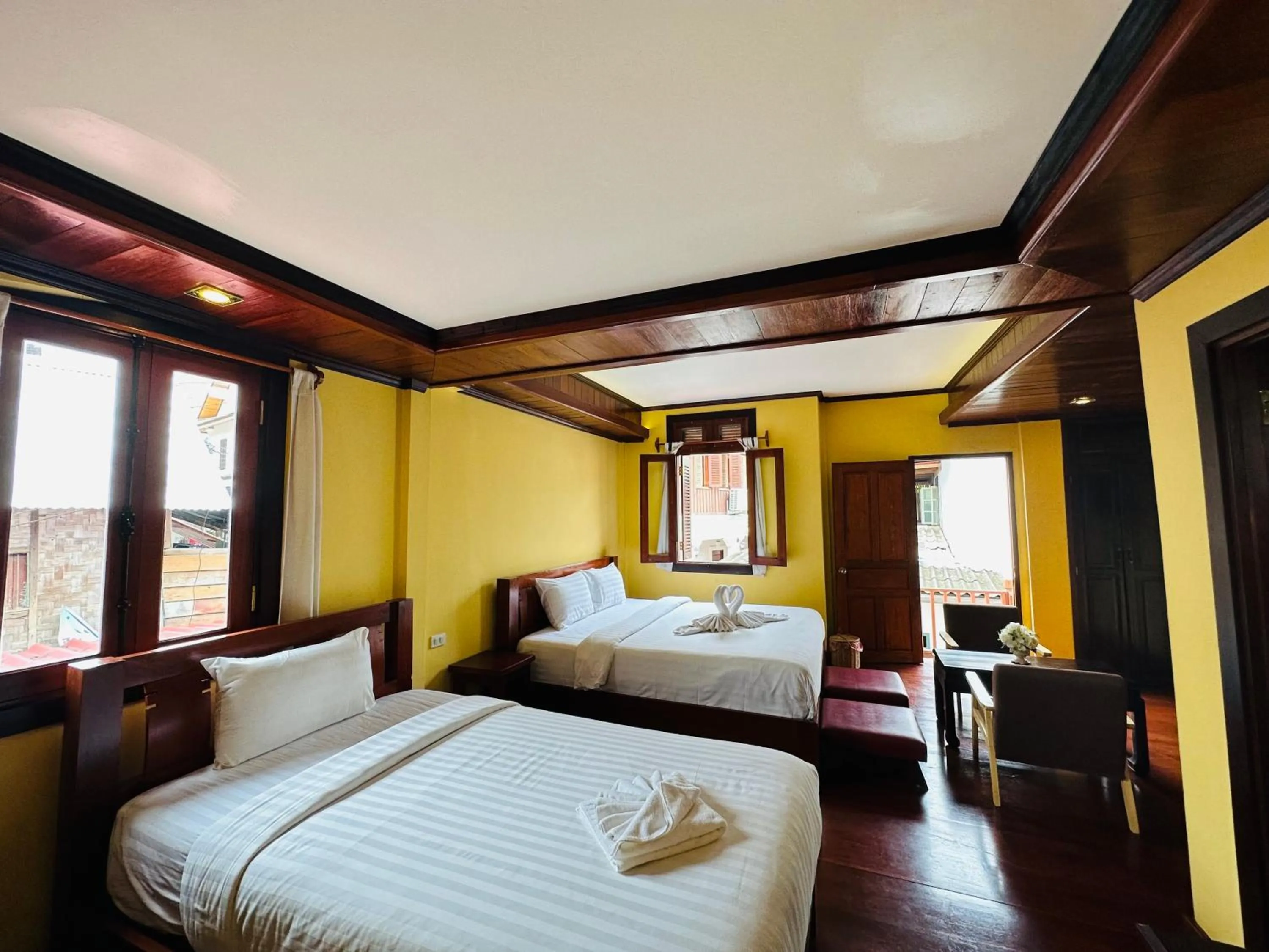 Bed in Villa Phonethip Mekong Riverside