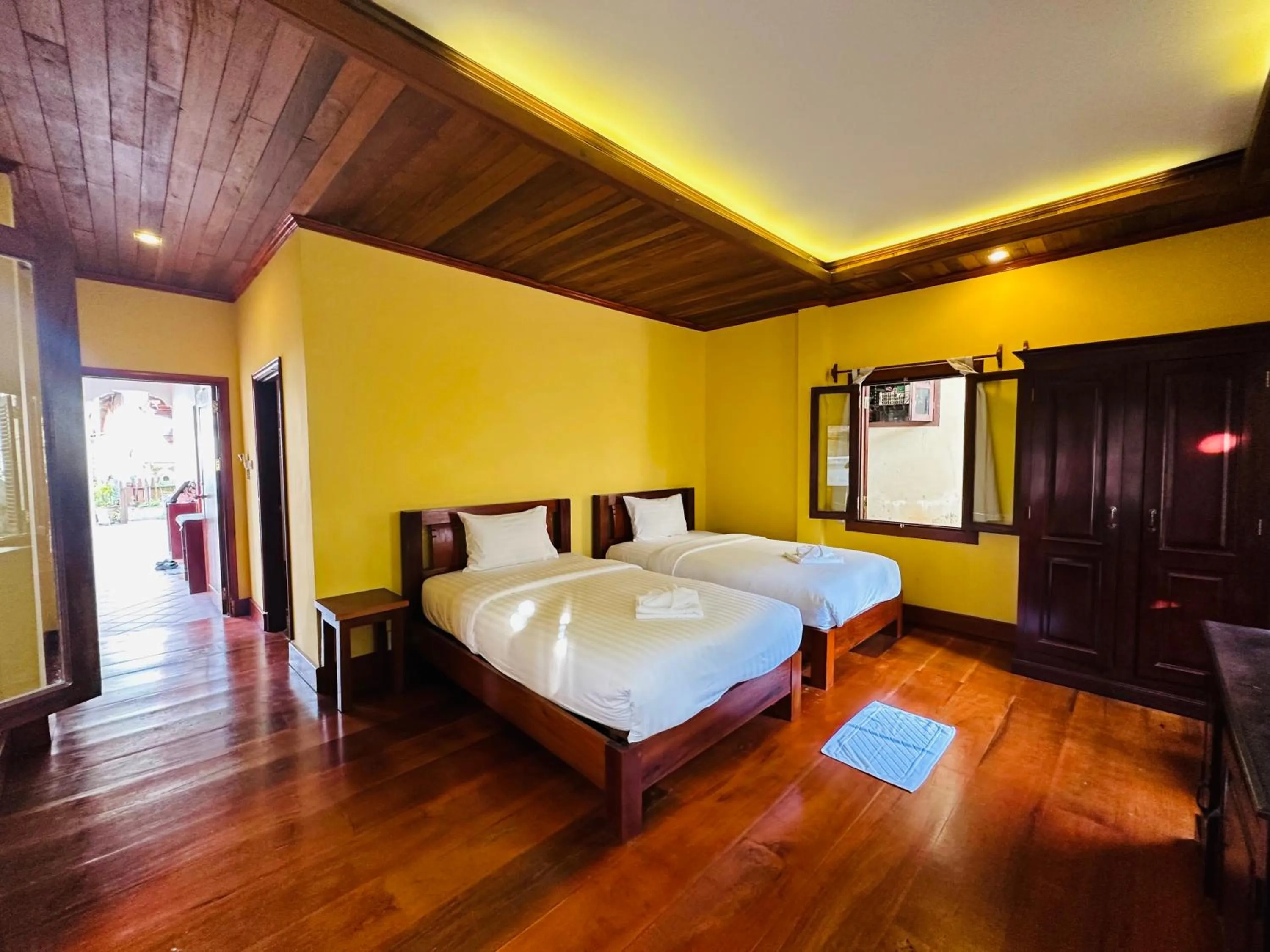 Bed in Villa Phonethip Mekong Riverside