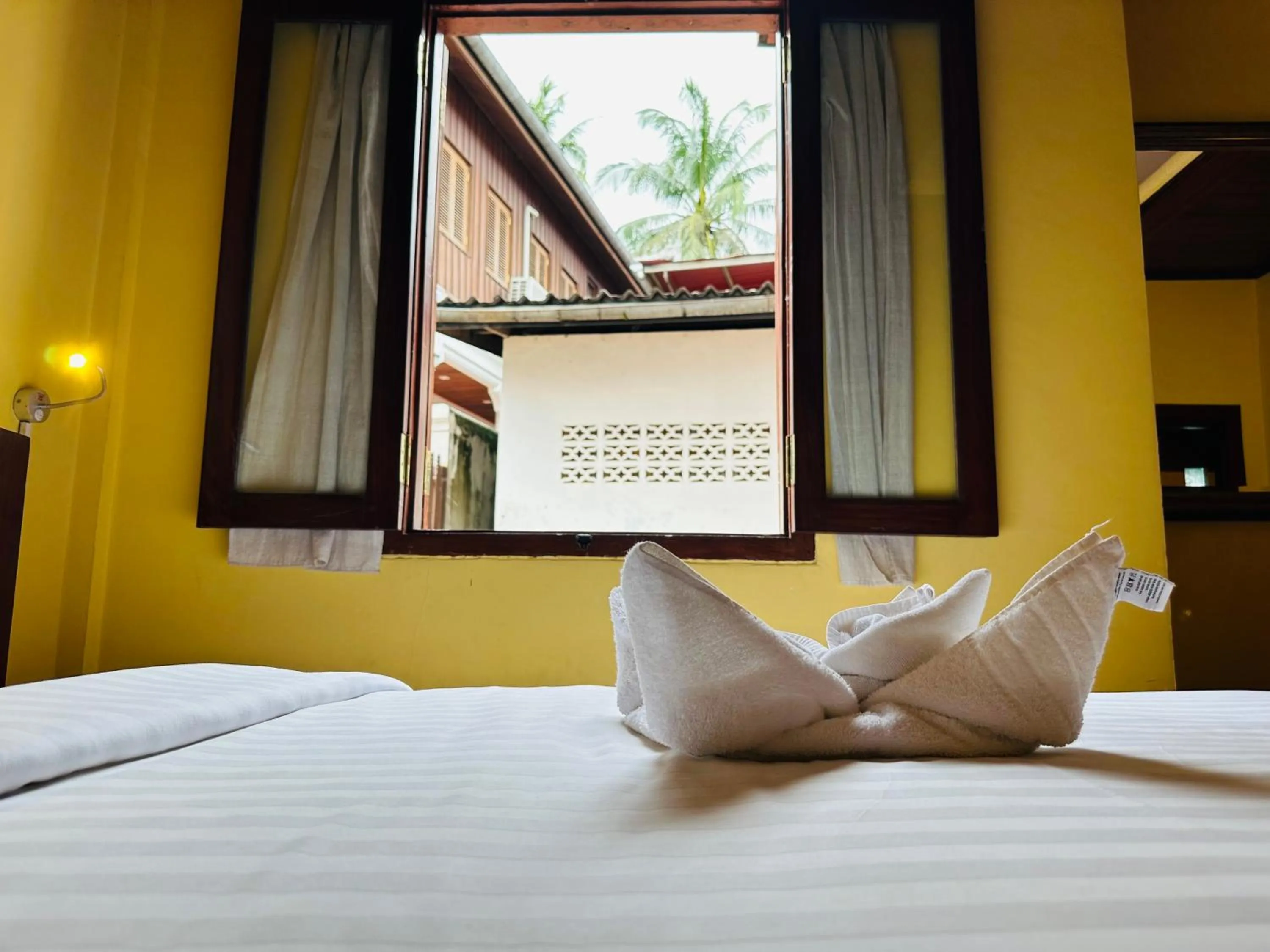 Bed in Villa Phonethip Mekong Riverside