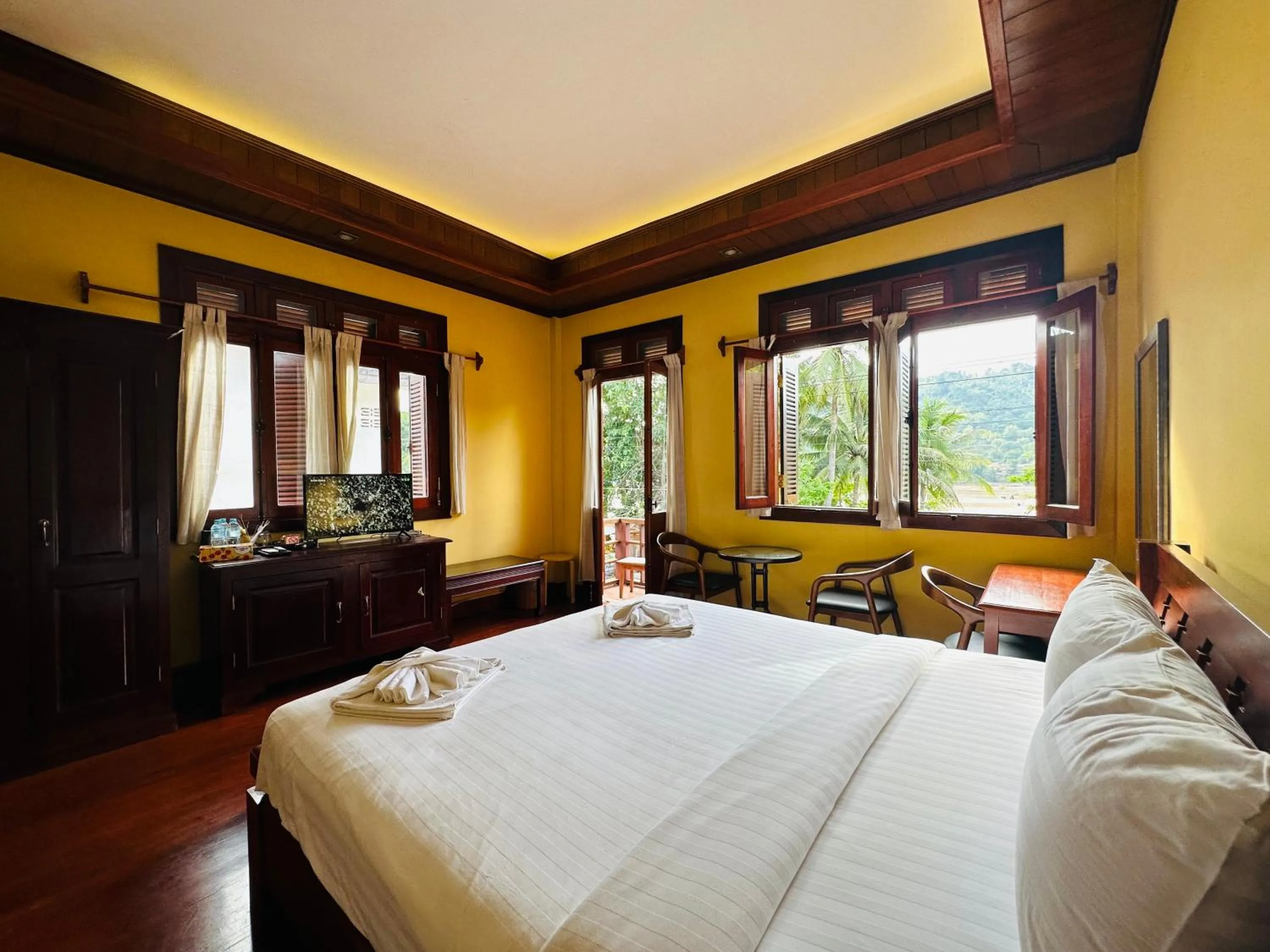 Bed in Villa Phonethip Mekong Riverside