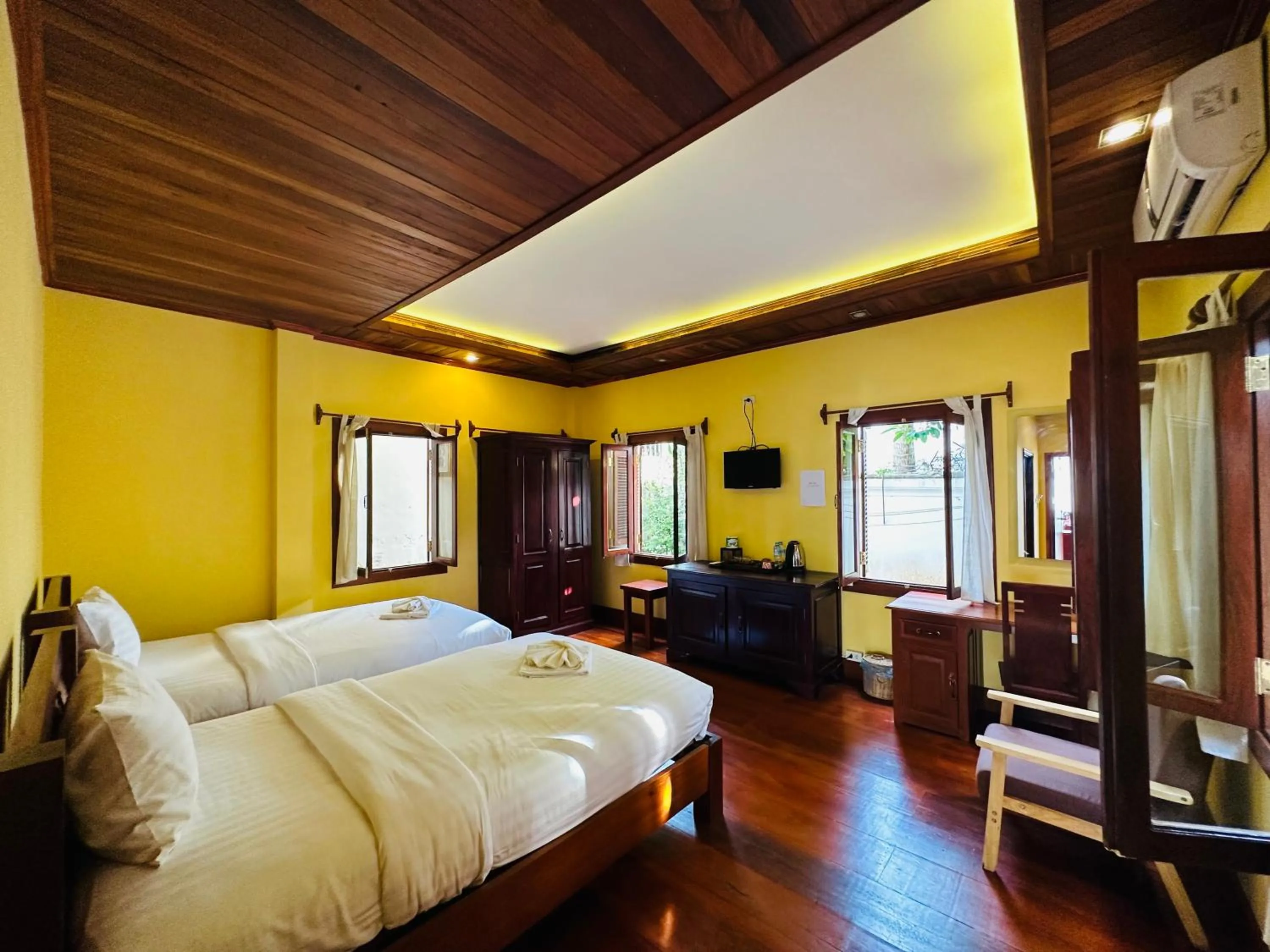 Communal lounge/ TV room, Bed in Villa Phonethip Mekong Riverside