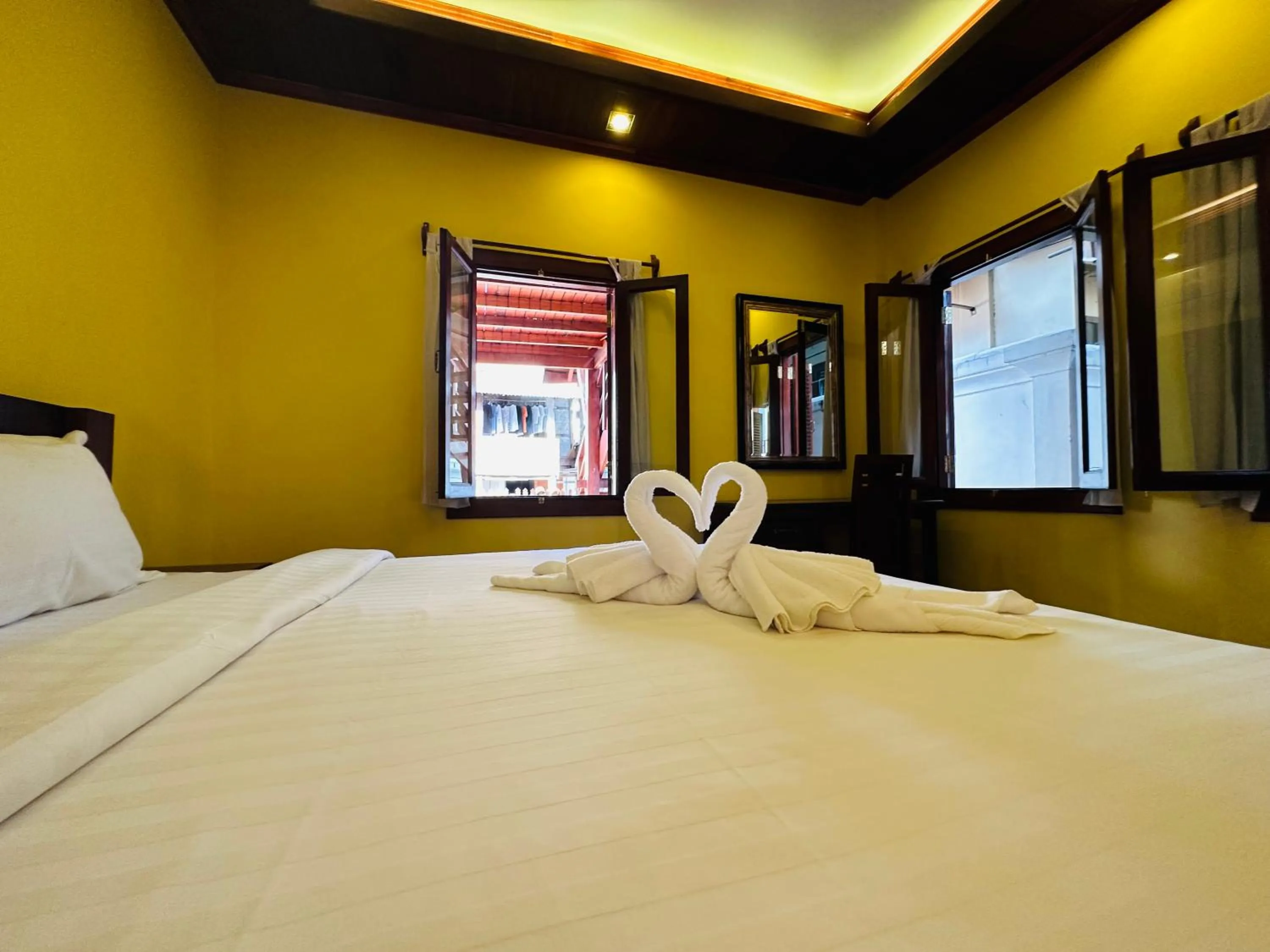 Bed in Villa Phonethip Mekong Riverside