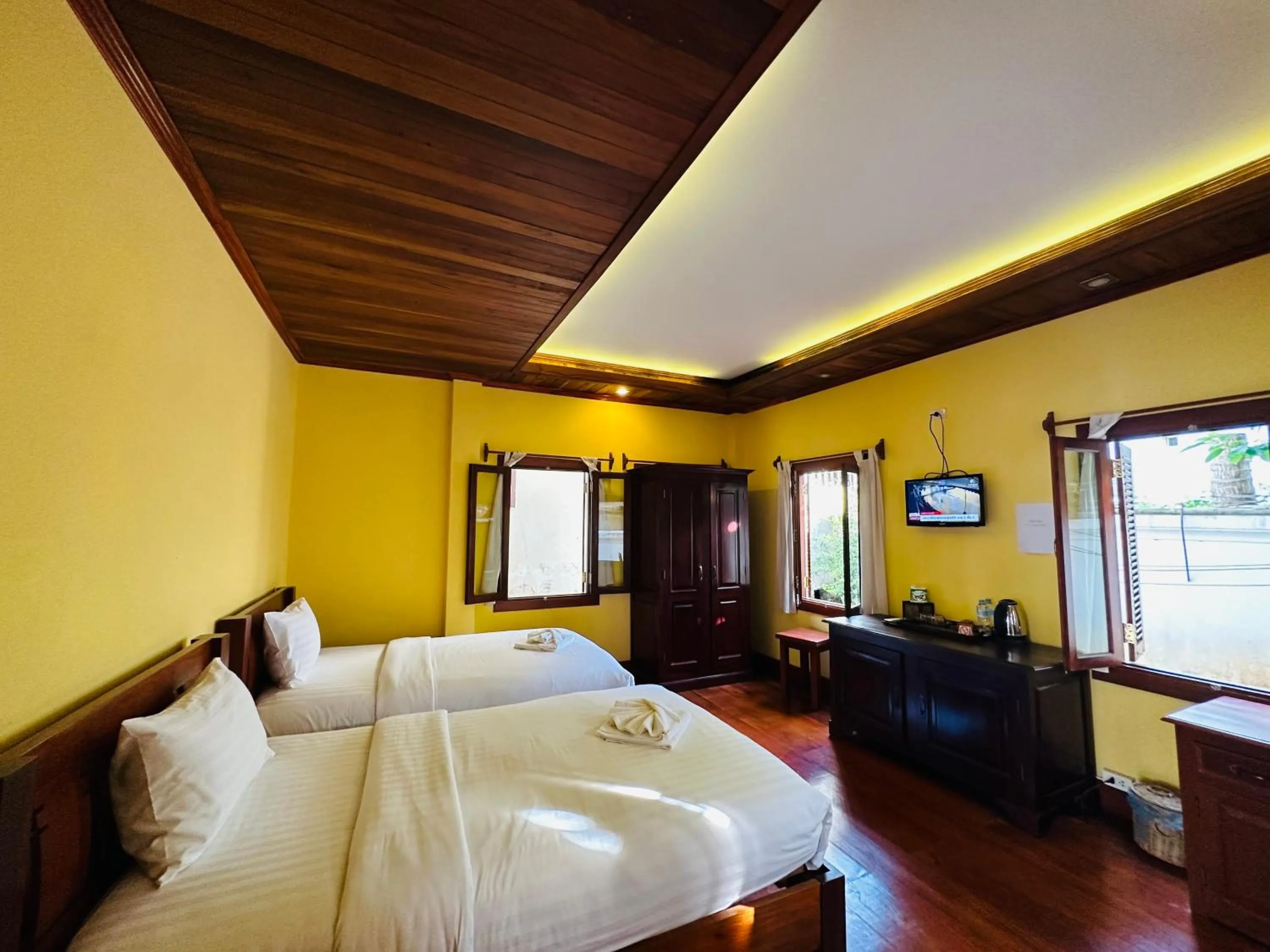 Communal lounge/ TV room, Bed in Villa Phonethip Mekong Riverside