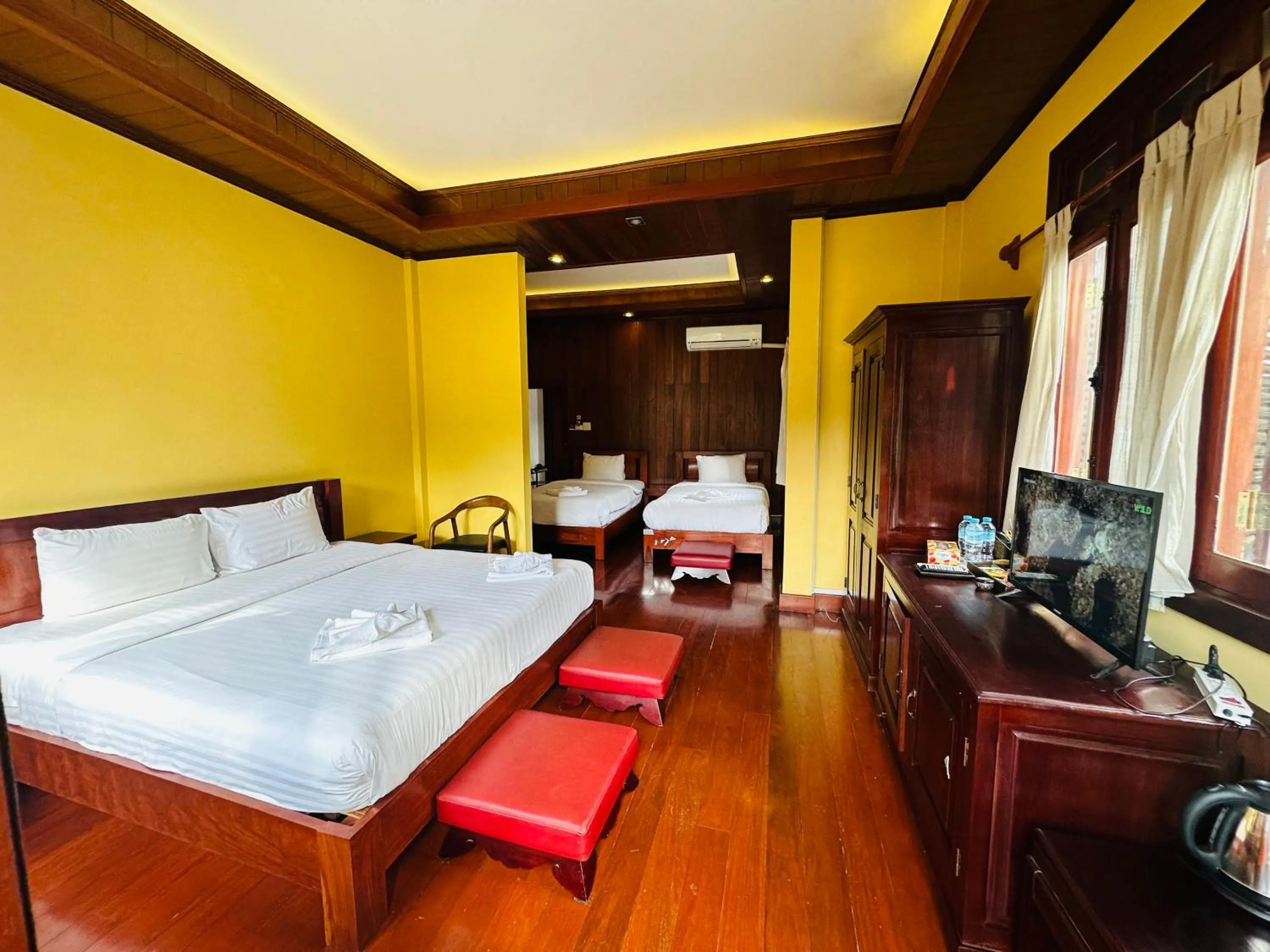 Bed in Villa Phonethip Mekong Riverside