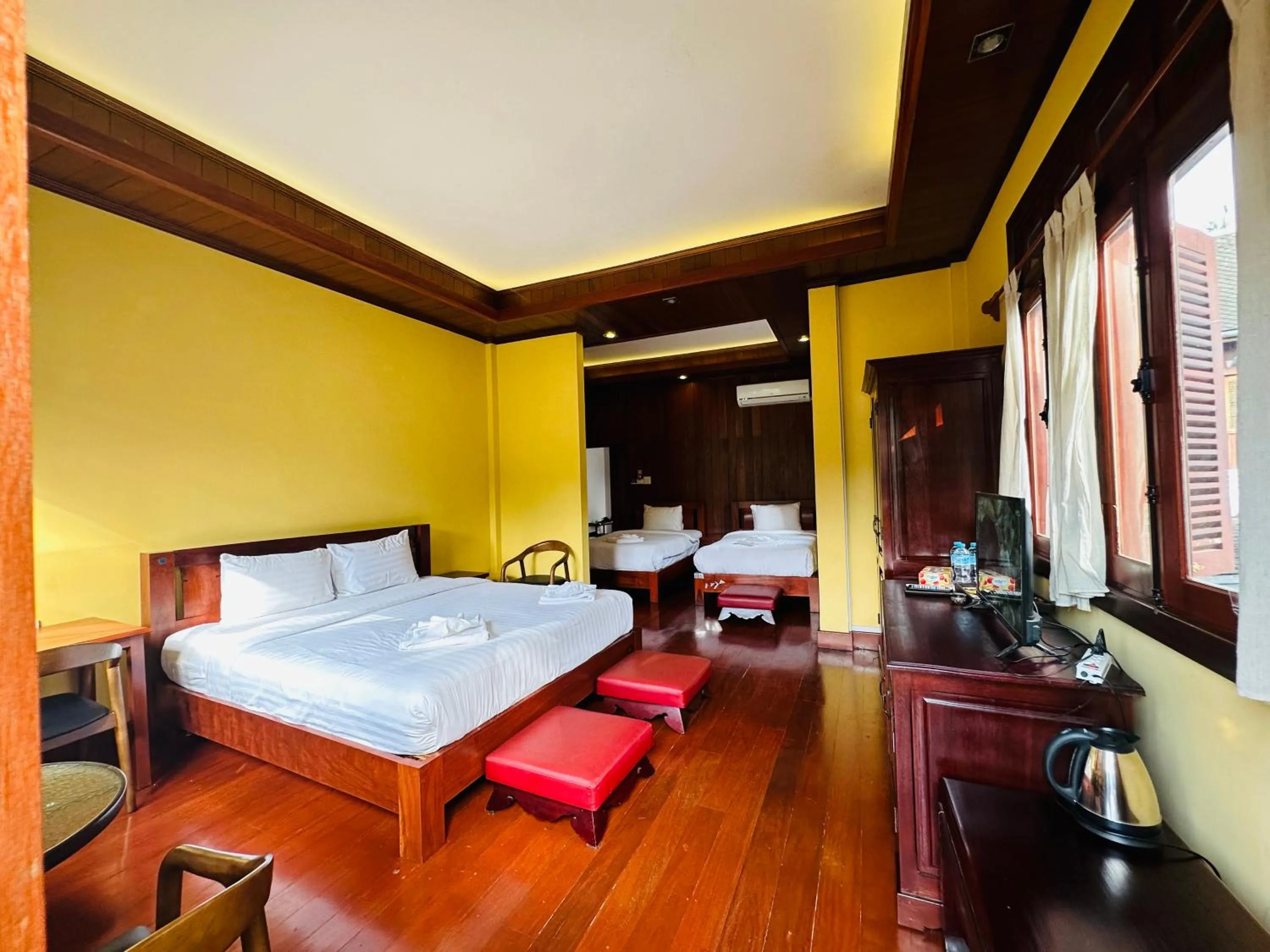 Bed in Villa Phonethip Mekong Riverside