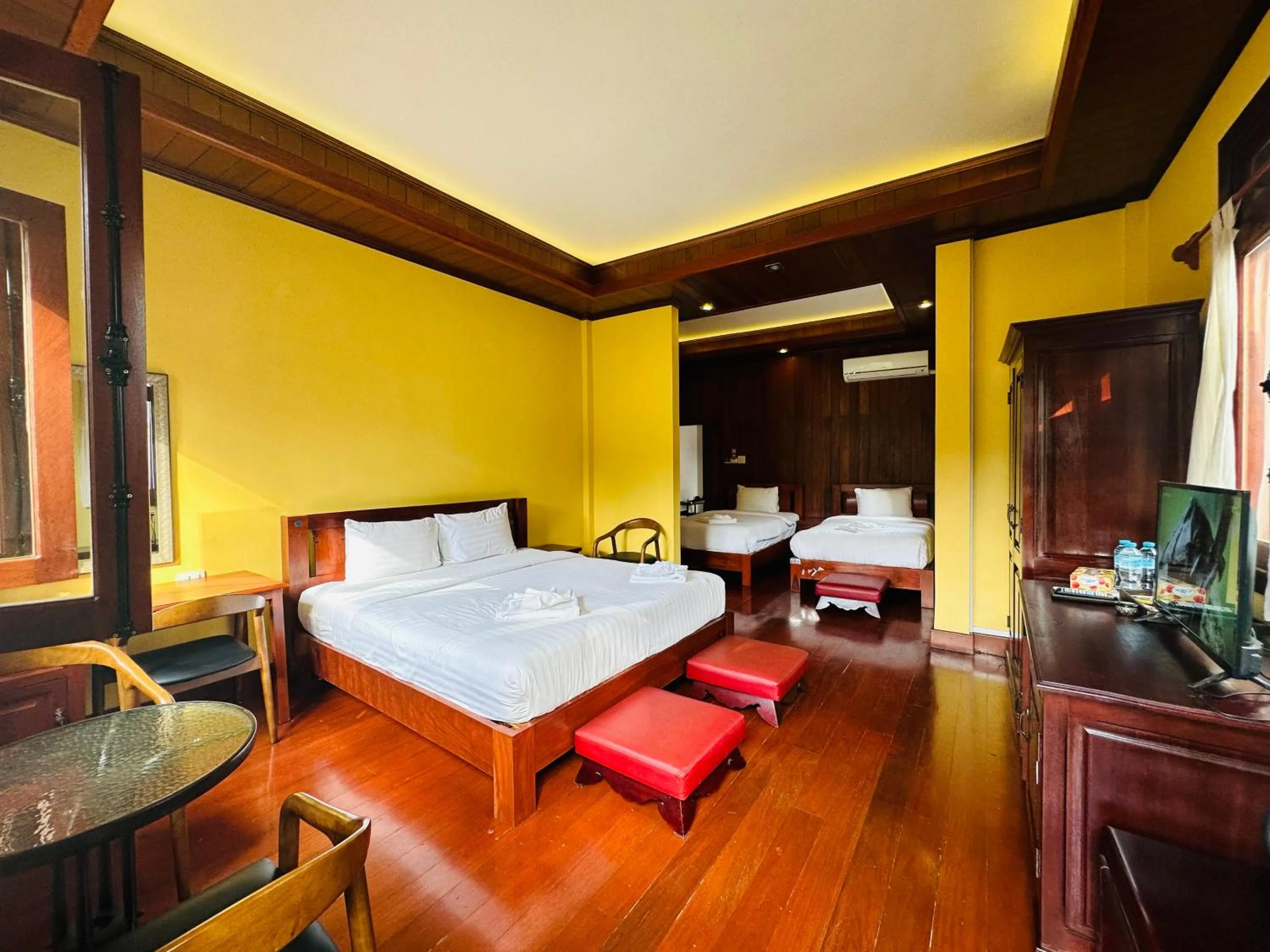 Communal lounge/ TV room, Bed in Villa Phonethip Mekong Riverside