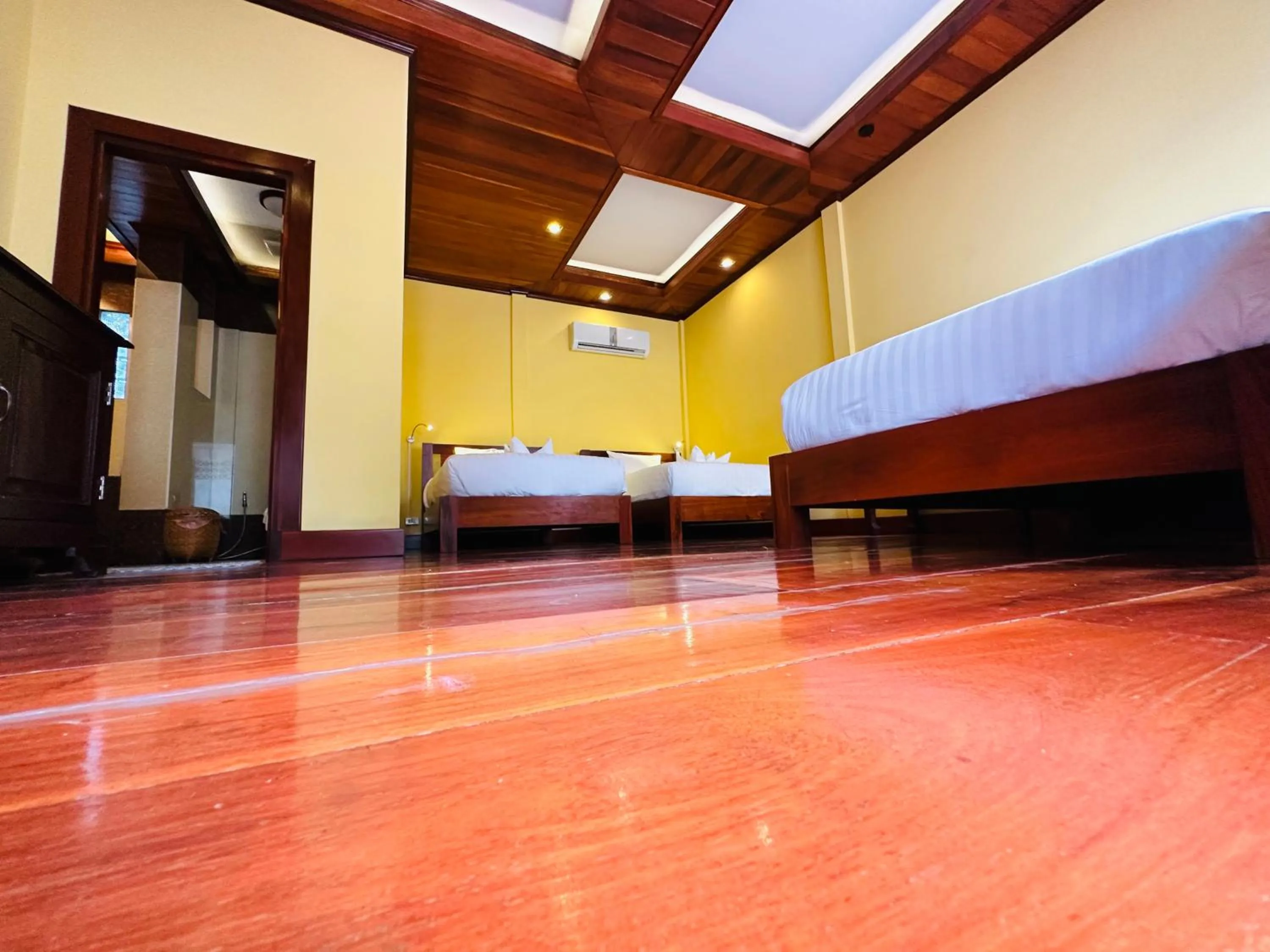 Bed in Villa Phonethip Mekong Riverside