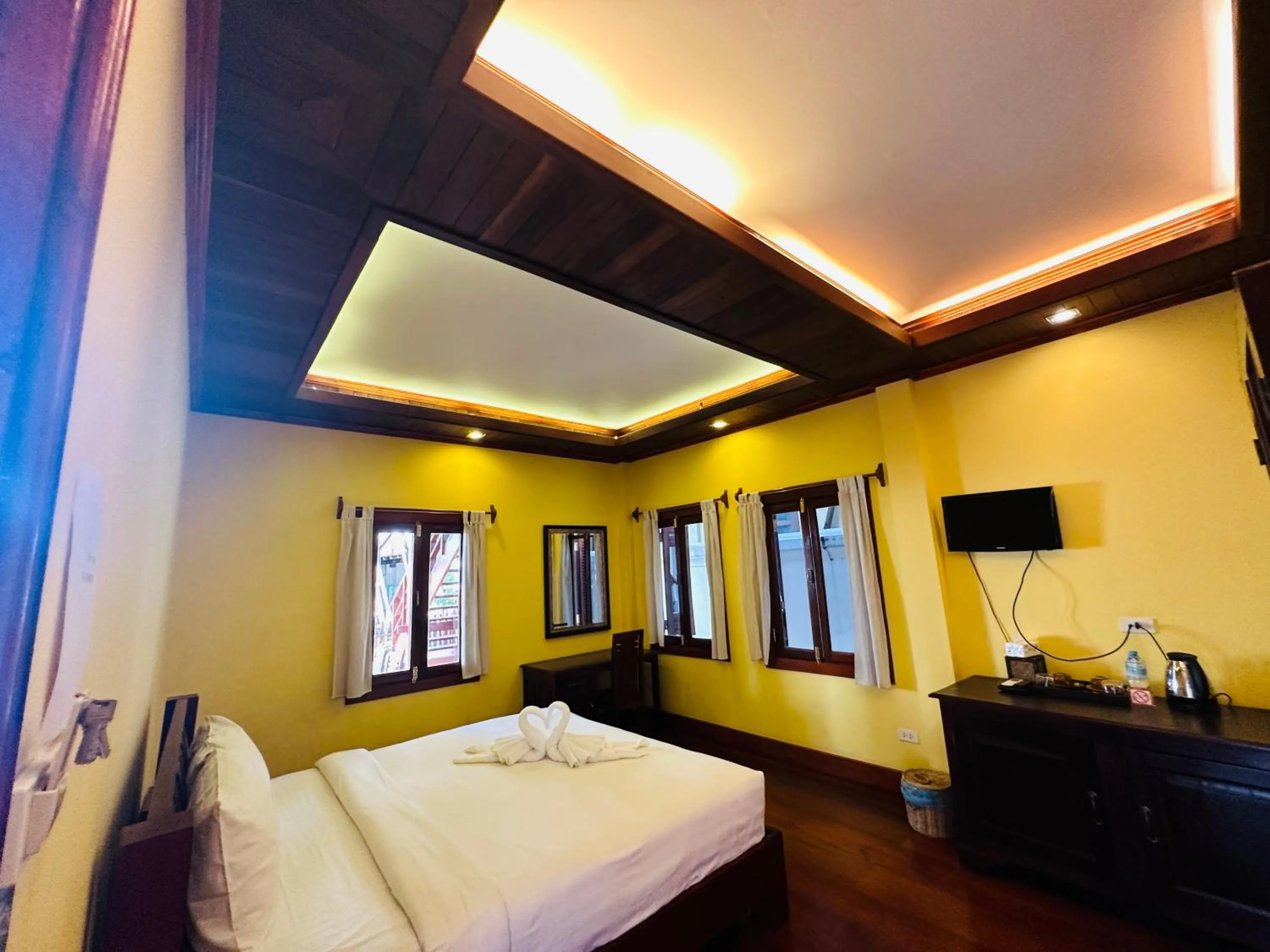 Bed in Villa Phonethip Mekong Riverside