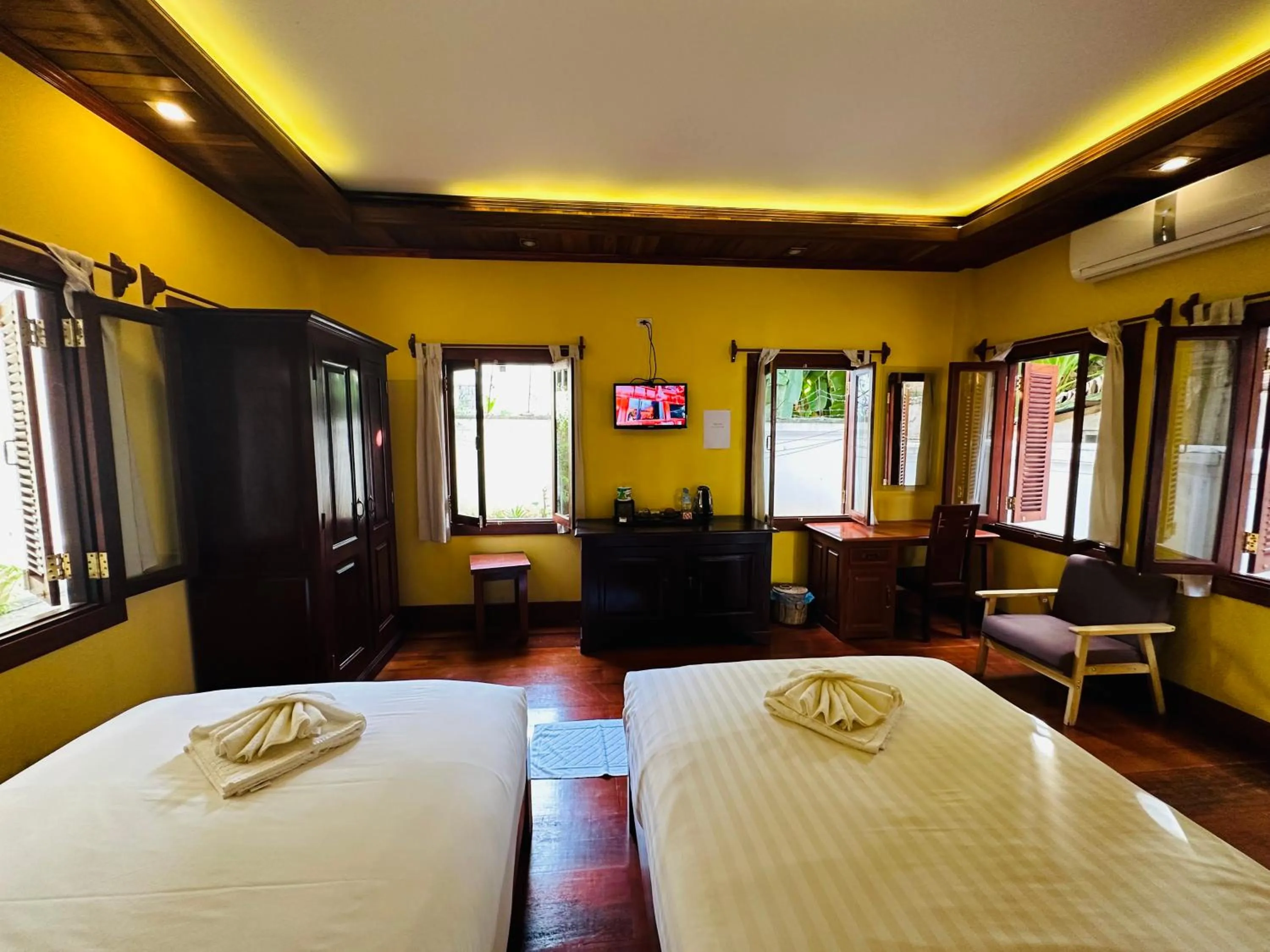 Communal lounge/ TV room, Bed in Villa Phonethip Mekong Riverside