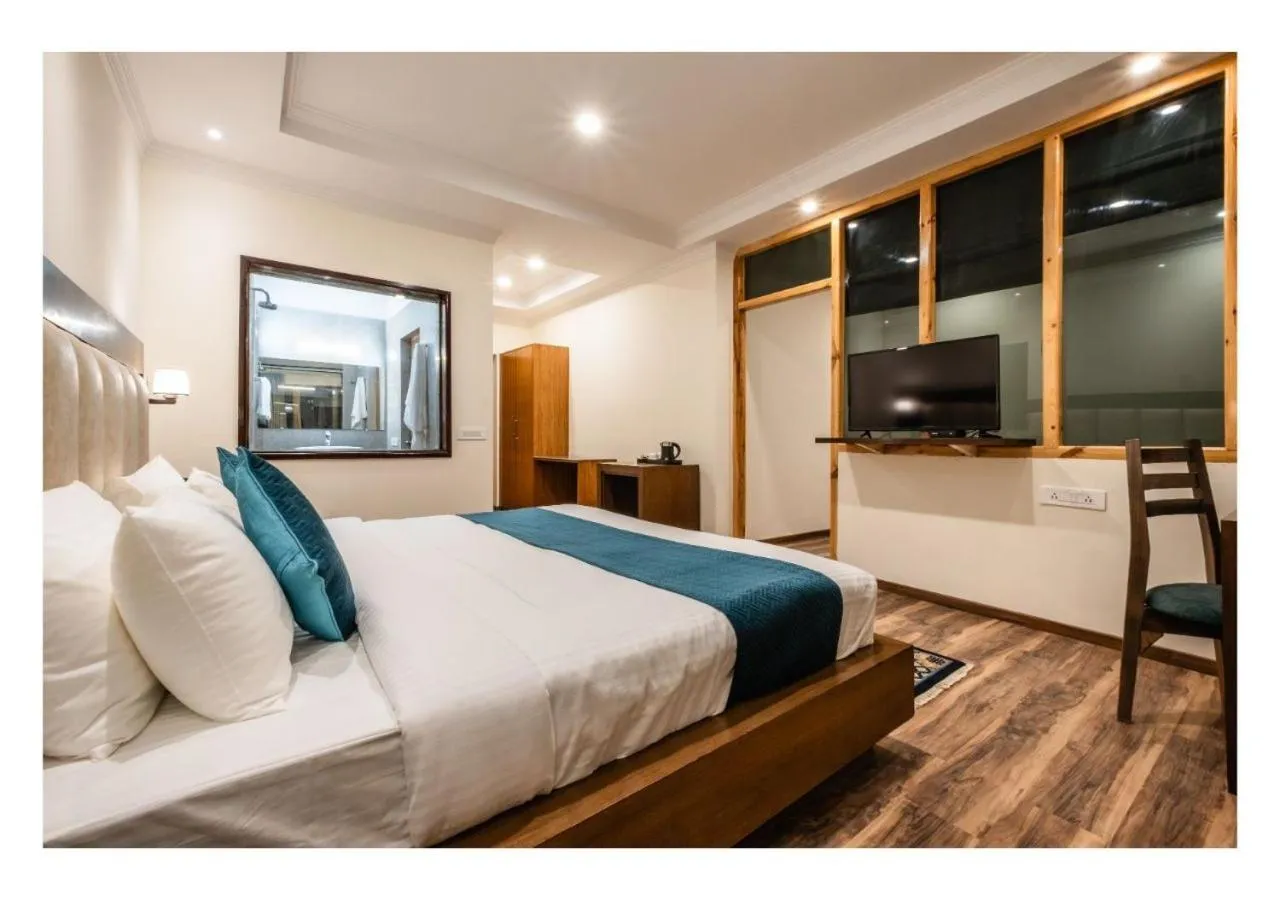 Bed in Hotel Kharu Vilaasa