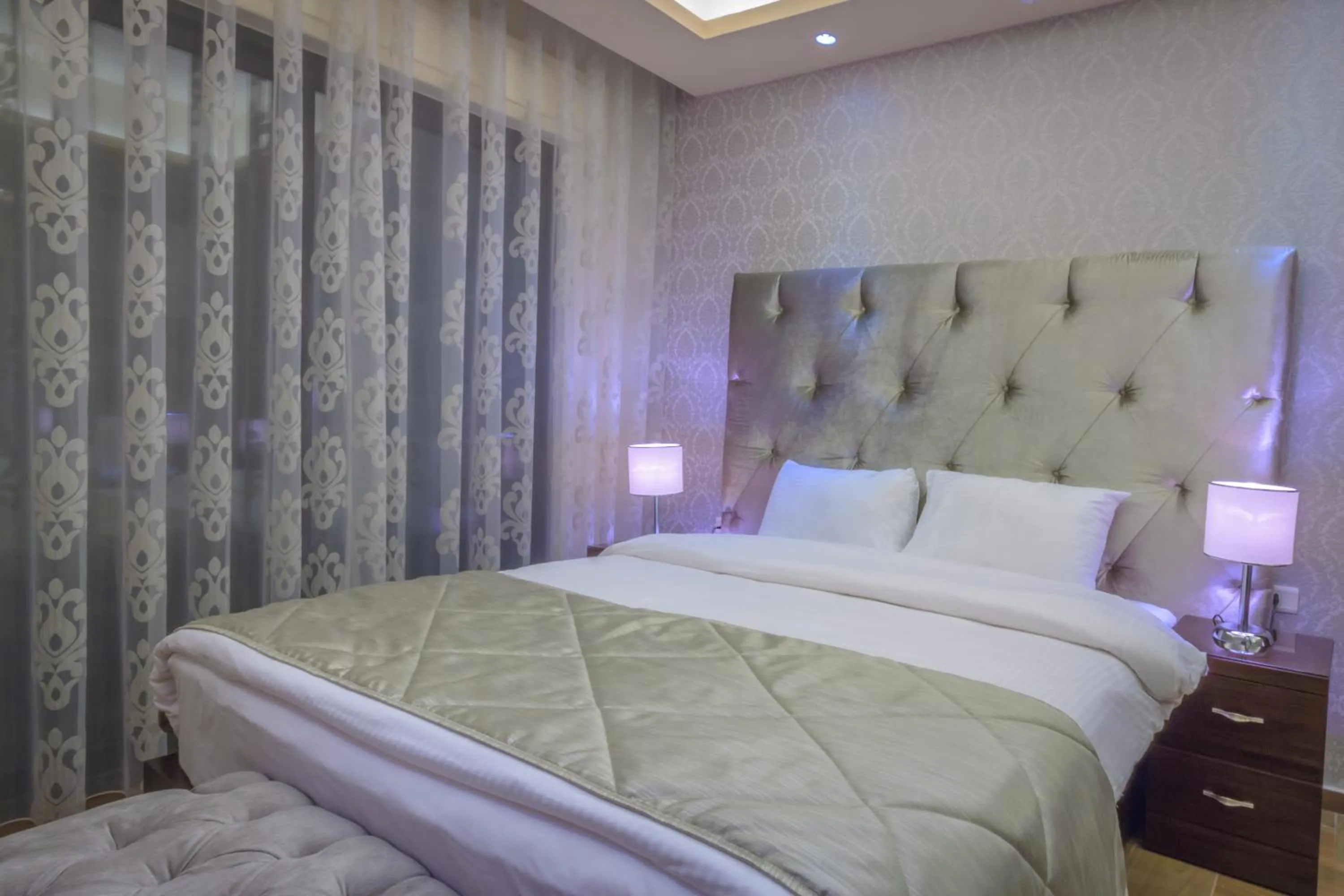 Bed in Nadine Hotel Suites