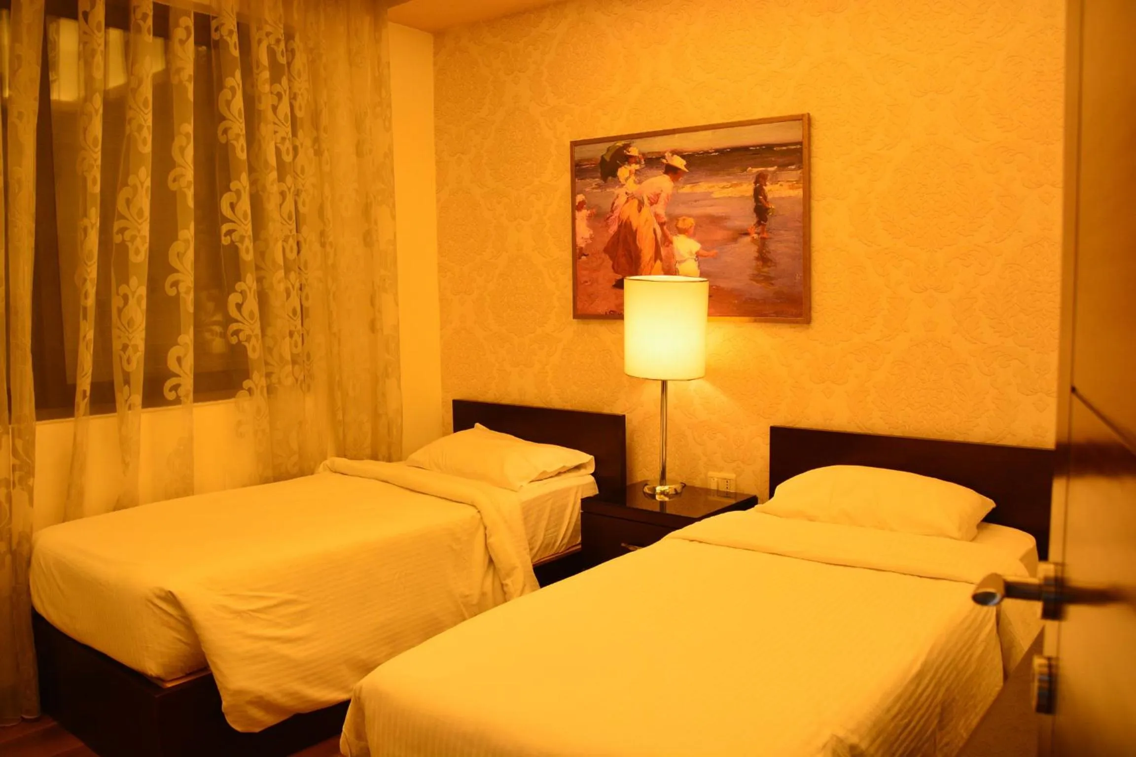 Bed in Nadine Hotel Suites