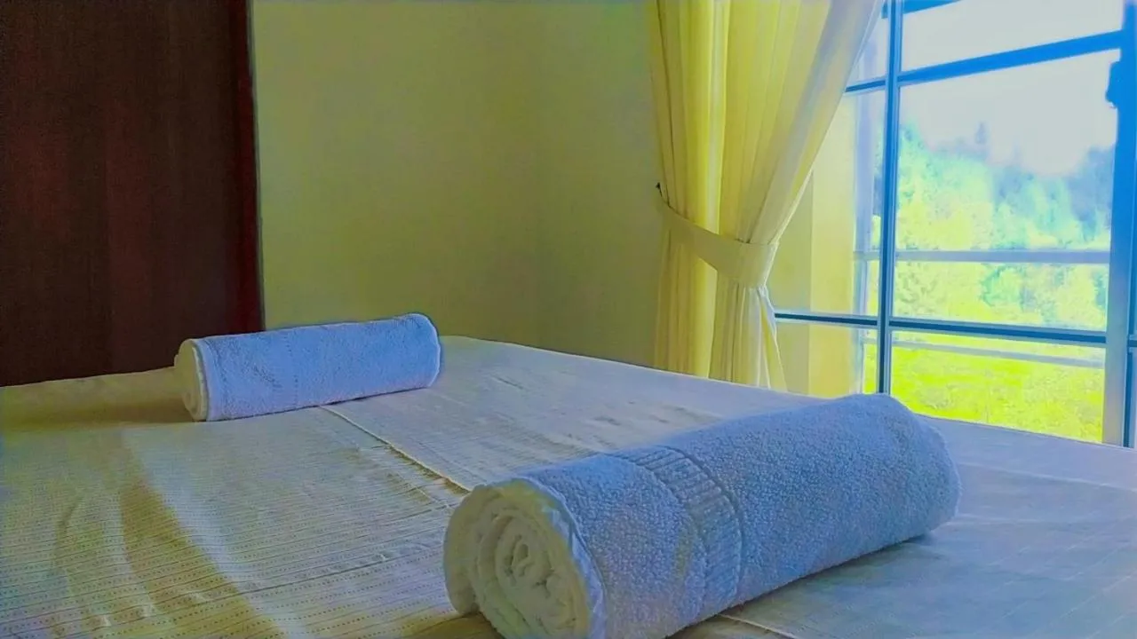 Bed in Lassana Holiday Bungalow