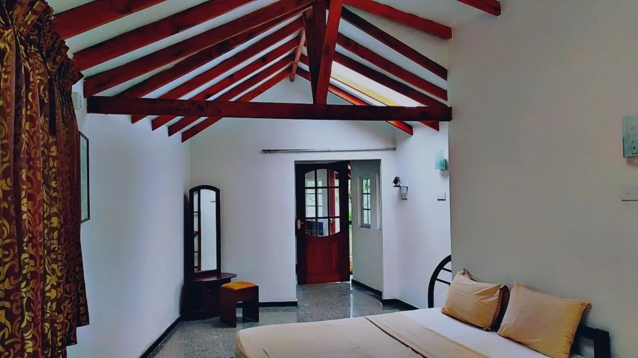 Photo of the whole room, Bed in Lassana Holiday Bungalow