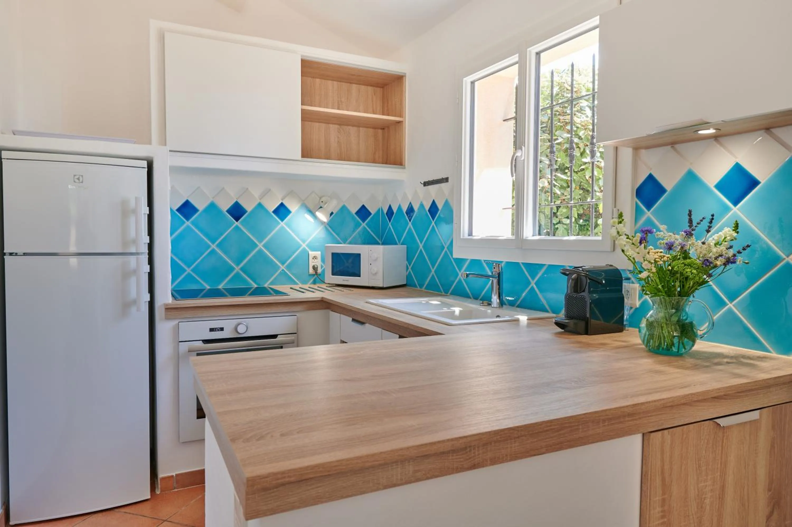 Kitchen or kitchenette in Résidence Belvedere de Palombaggia