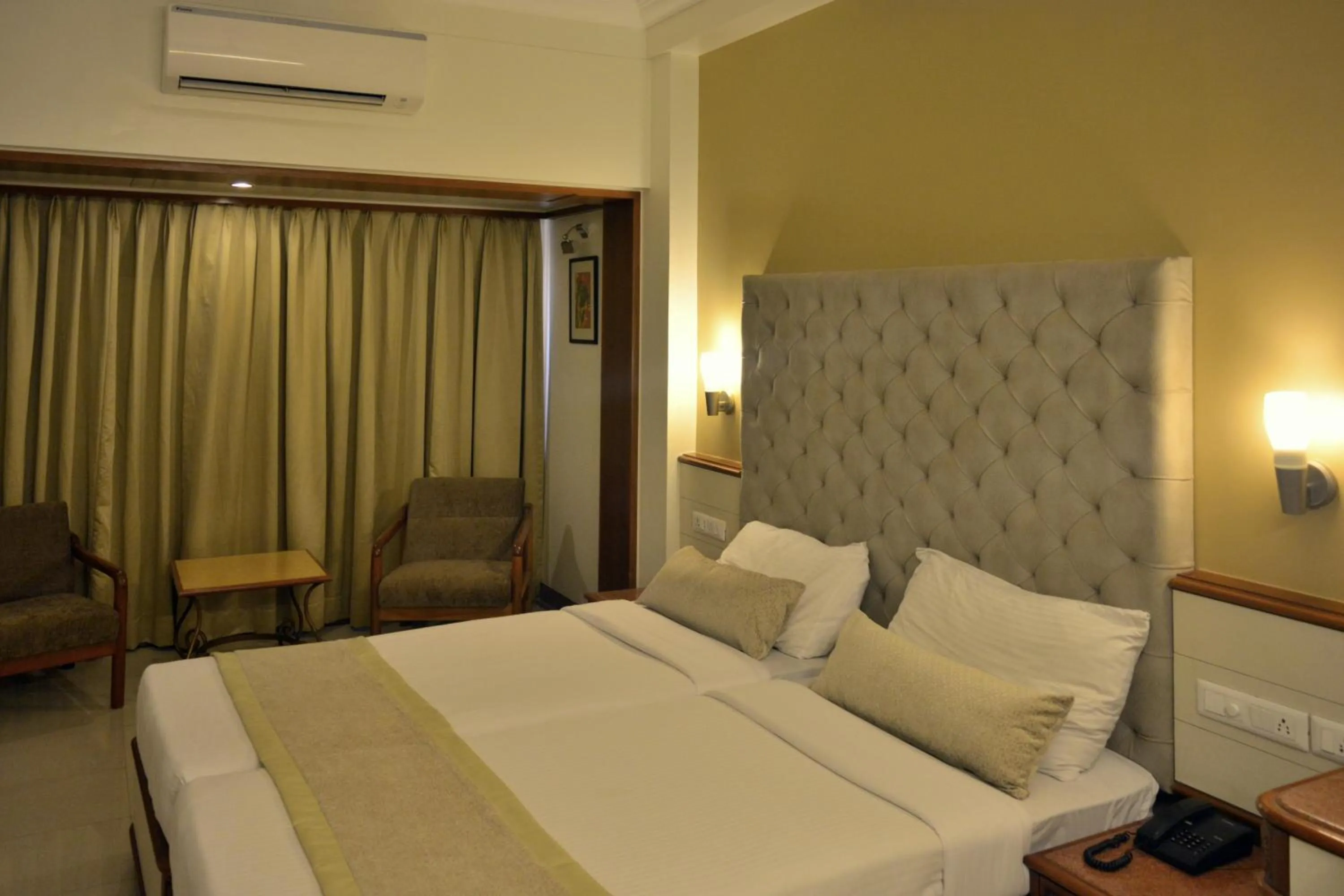 Bed in Hotel Shree Panchratna Pune