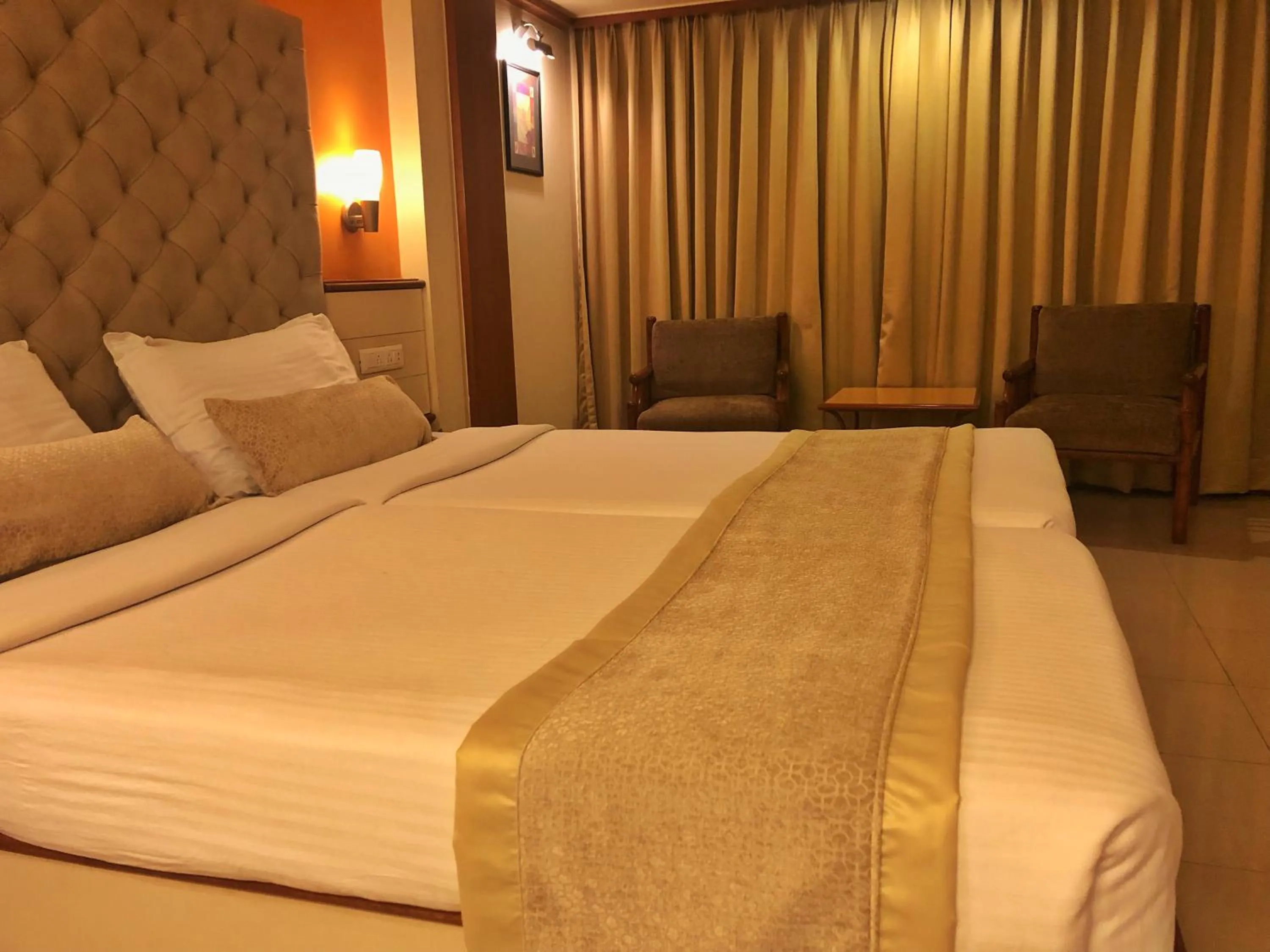 Bedroom, Bed in Hotel Shree Panchratna Pune