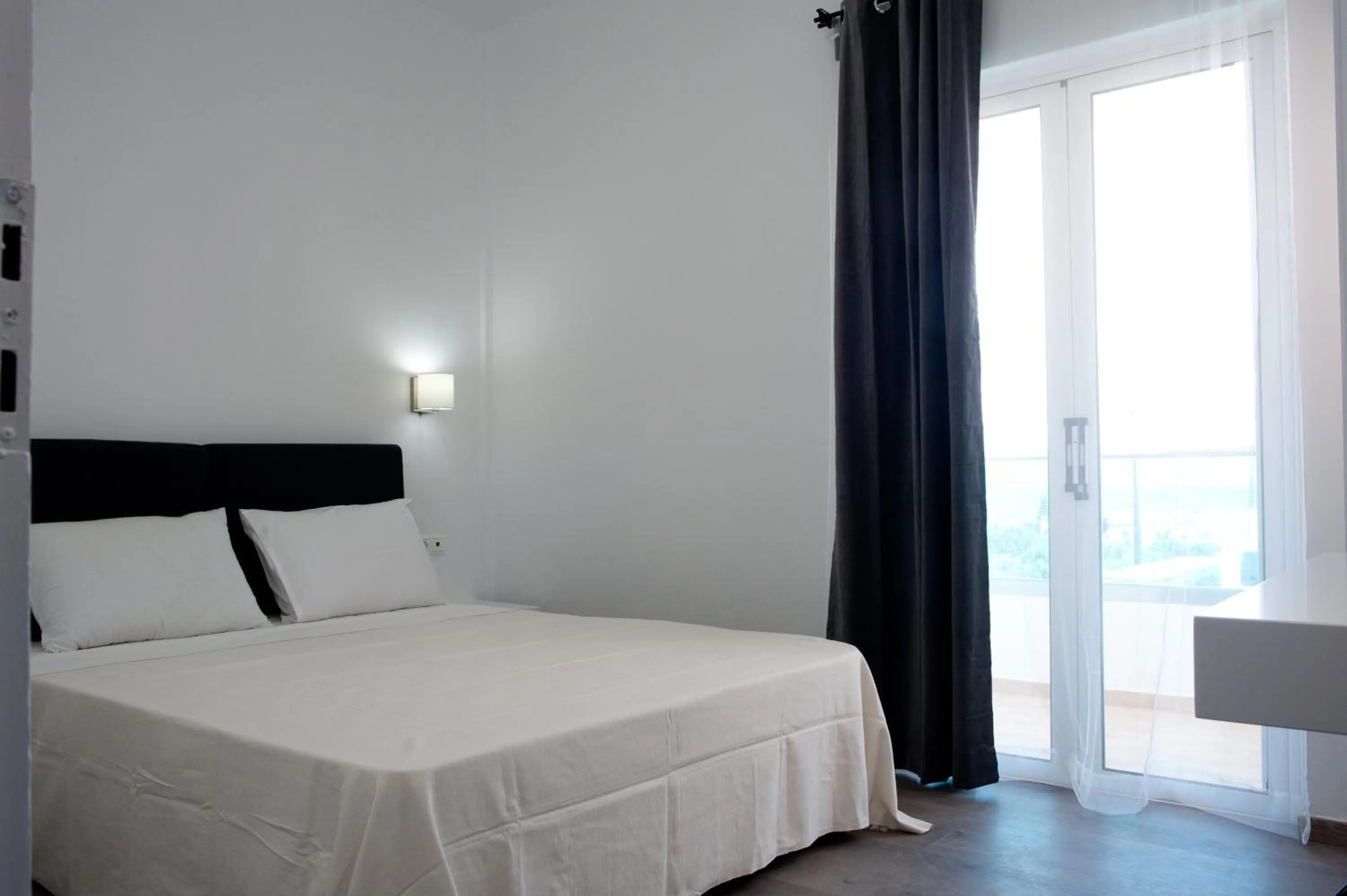 Bed in Aestas Apartments