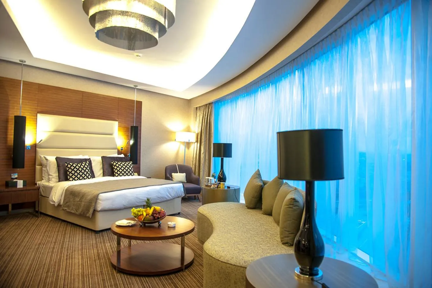 Photo of the whole room, Bed in Grand Millennium Sulaimani