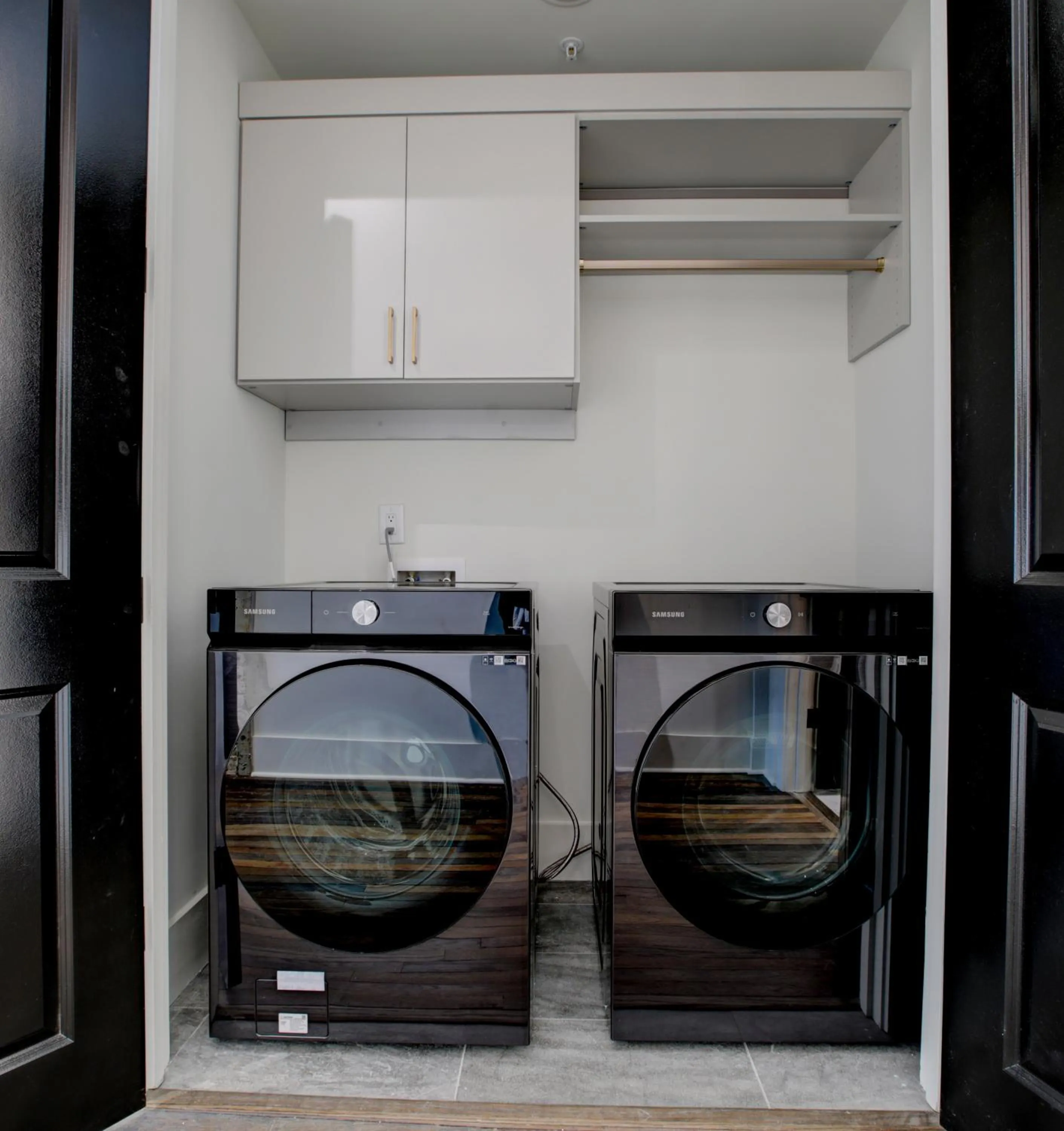 washing machine in Loft condo by Mercedes Benz w balcony Apt 101