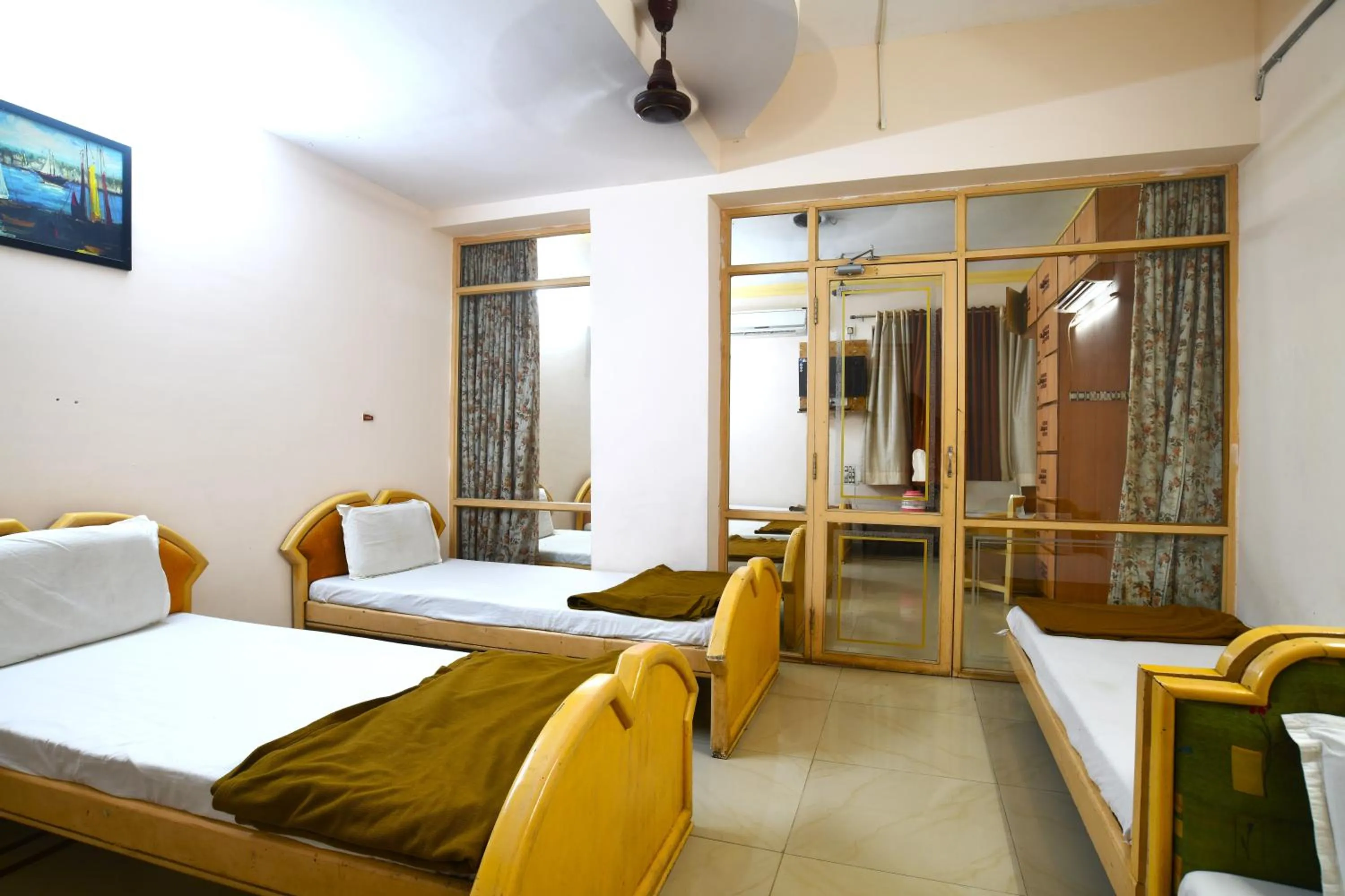 Bedroom in Hotel Vrundavan Residency