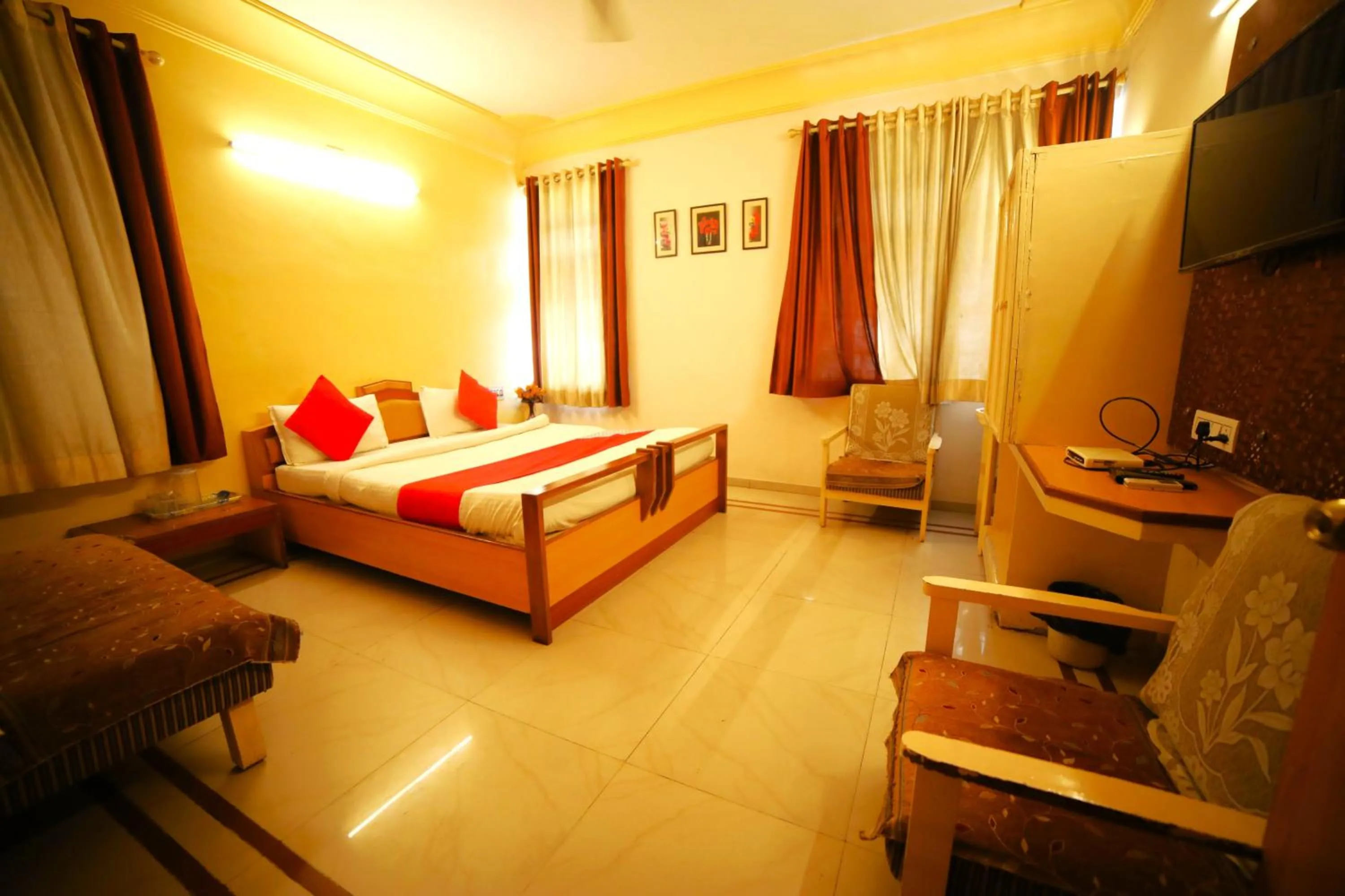 Bedroom in Hotel Vrundavan Residency