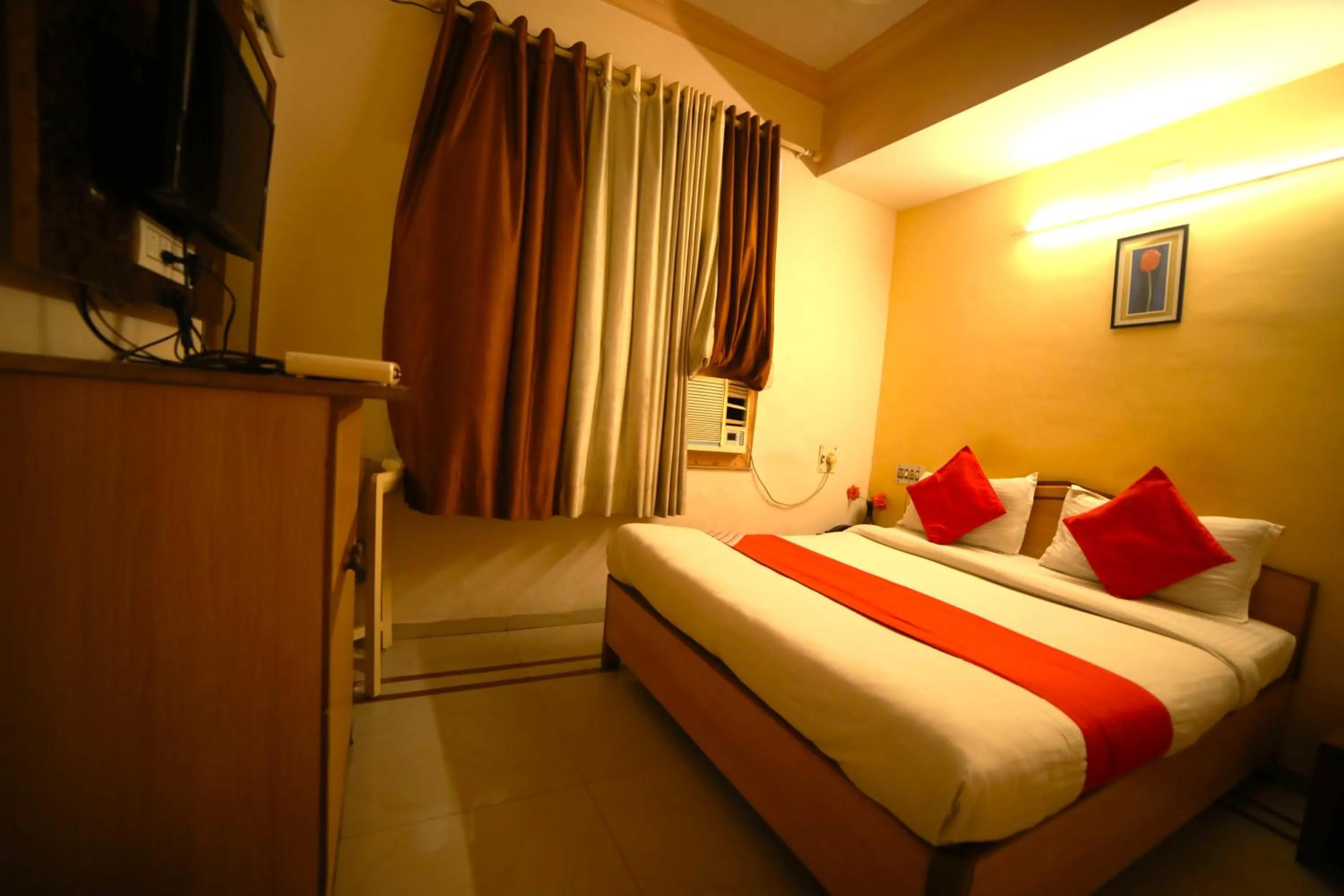 Bedroom in Hotel Vrundavan Residency