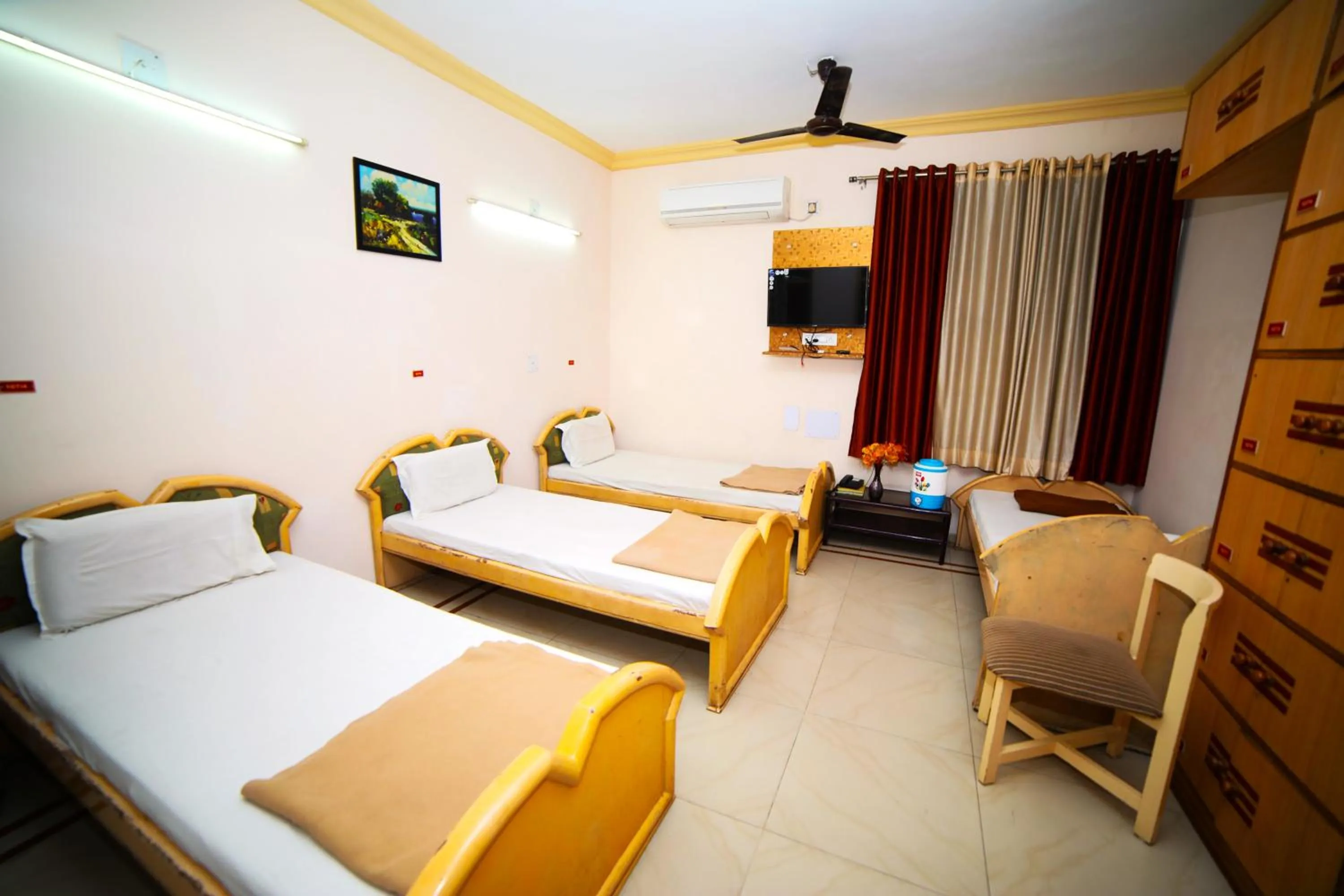 Bedroom in Hotel Vrundavan Residency