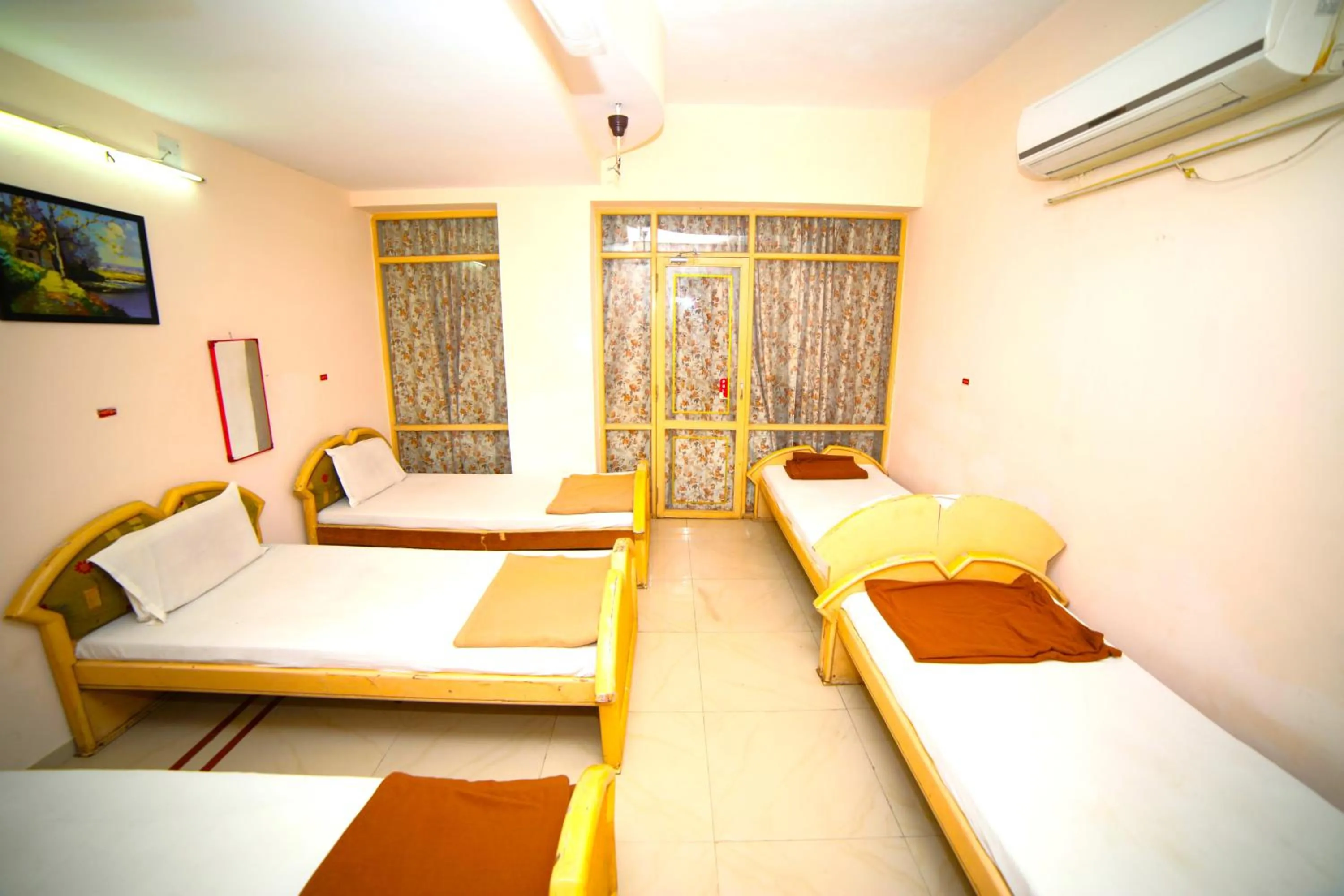 Bedroom in Hotel Vrundavan Residency