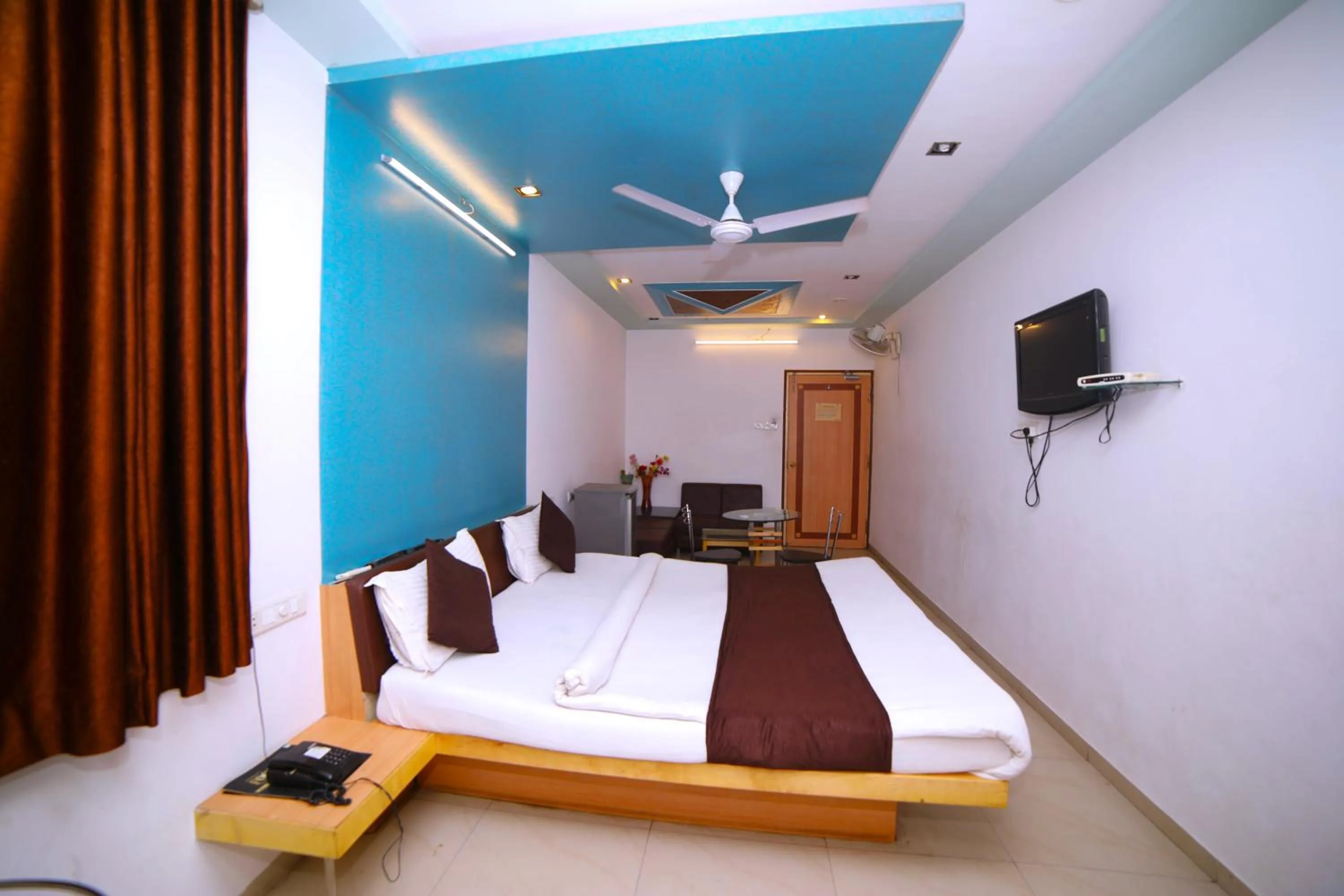 Bedroom in Hotel Vrundavan Residency