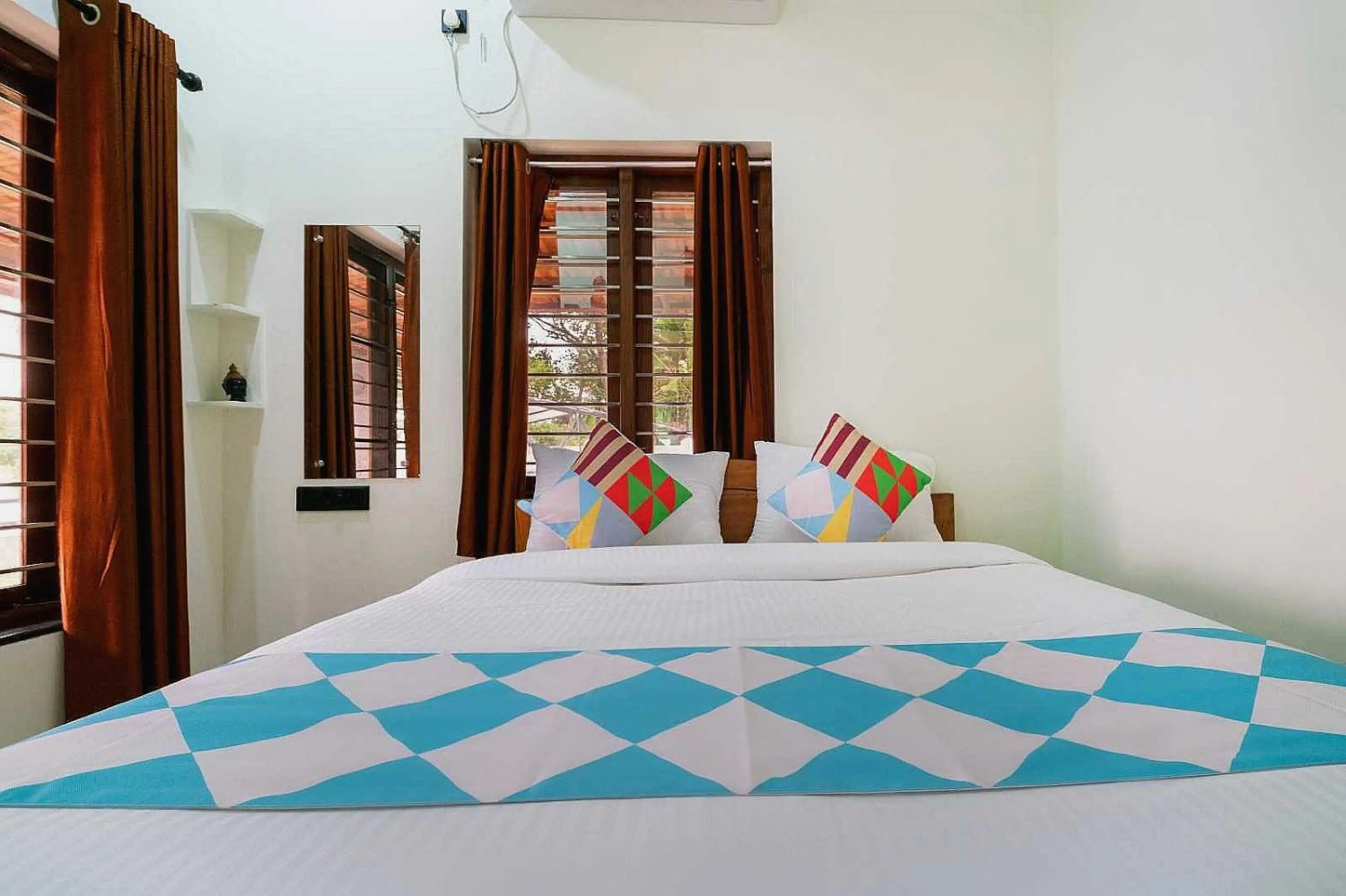 Bedroom in Hotel O ATHARVAM RESORT