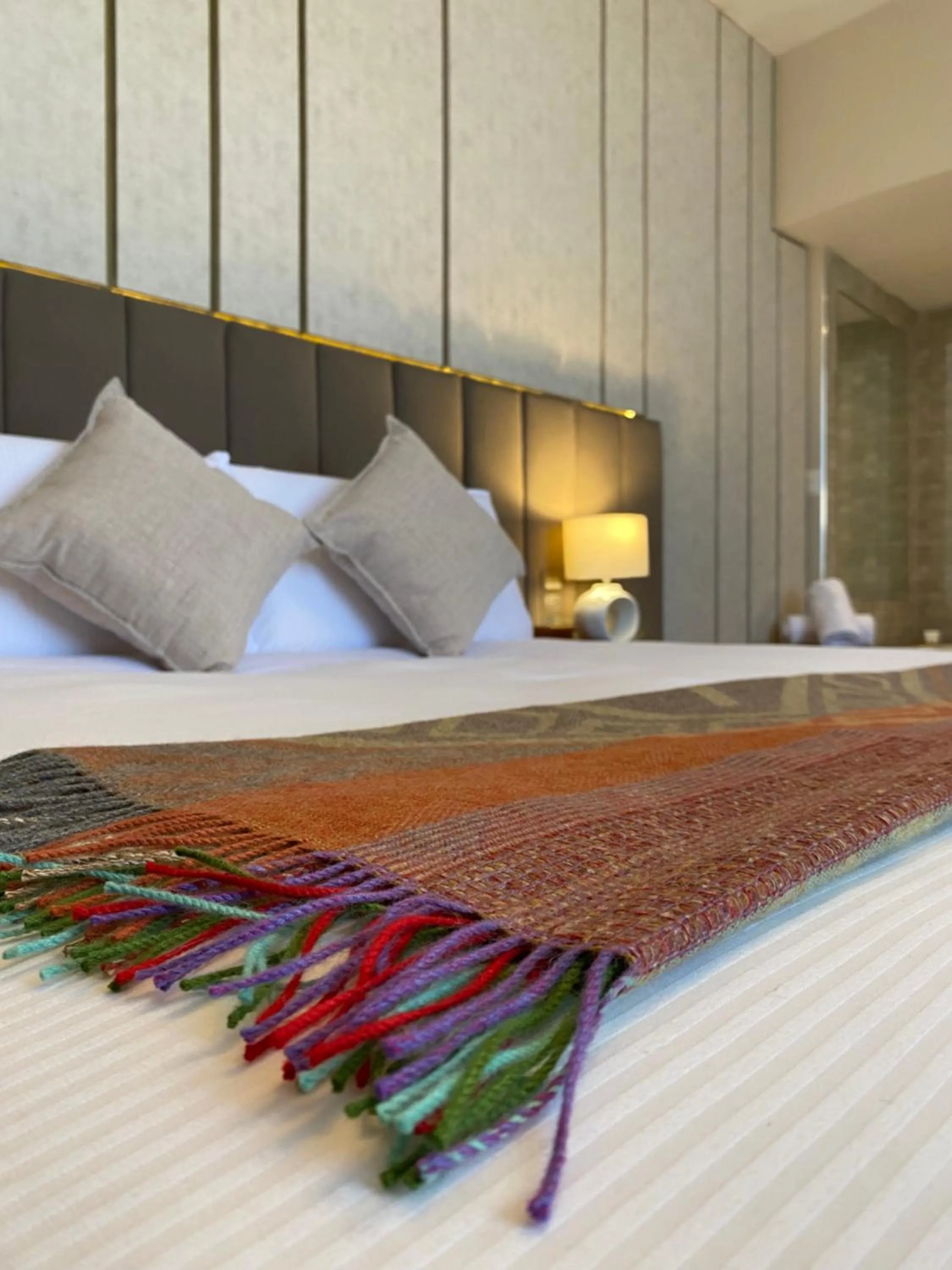 Bed in ARIQUEPAY HOTEL