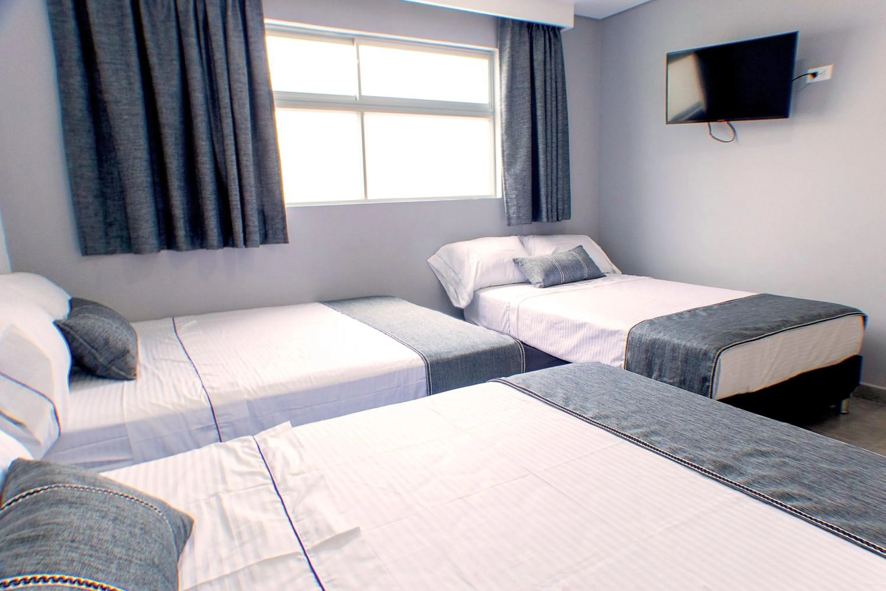 Bed in El Oscar Hotel