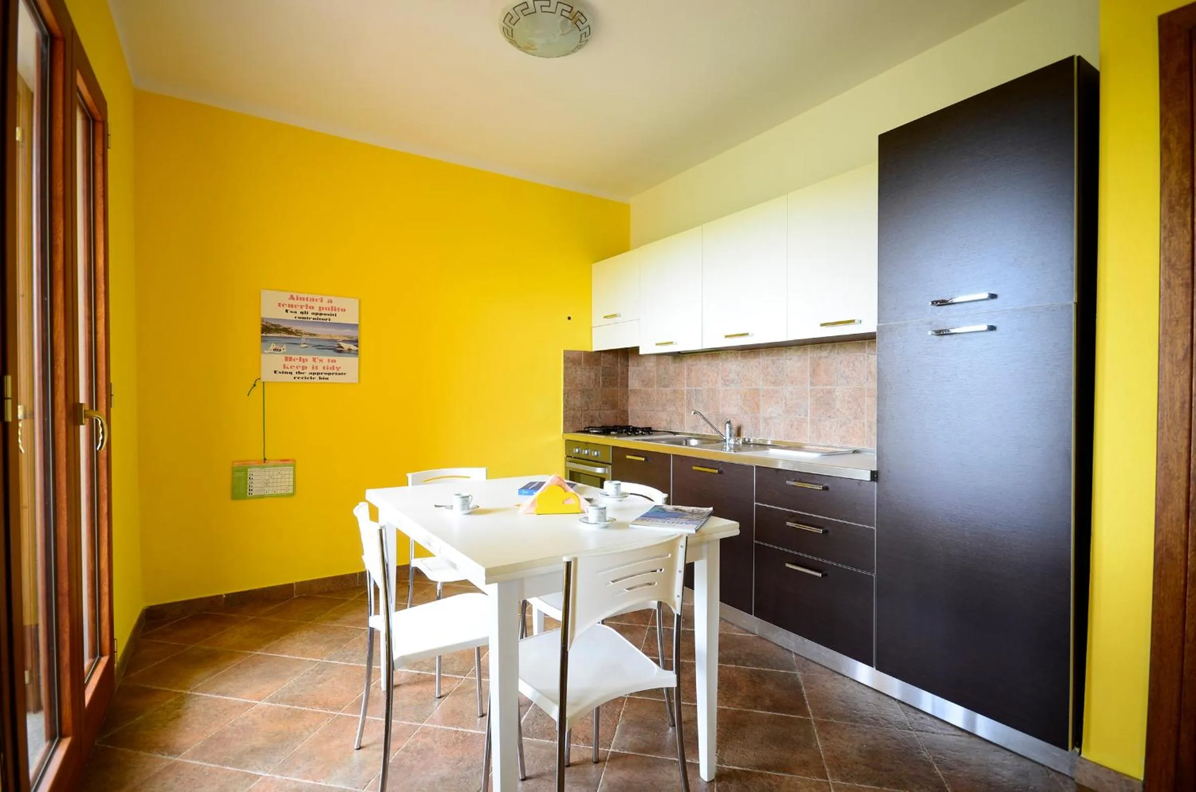 Kitchen or kitchenette in Residenze L'Isola Surf House