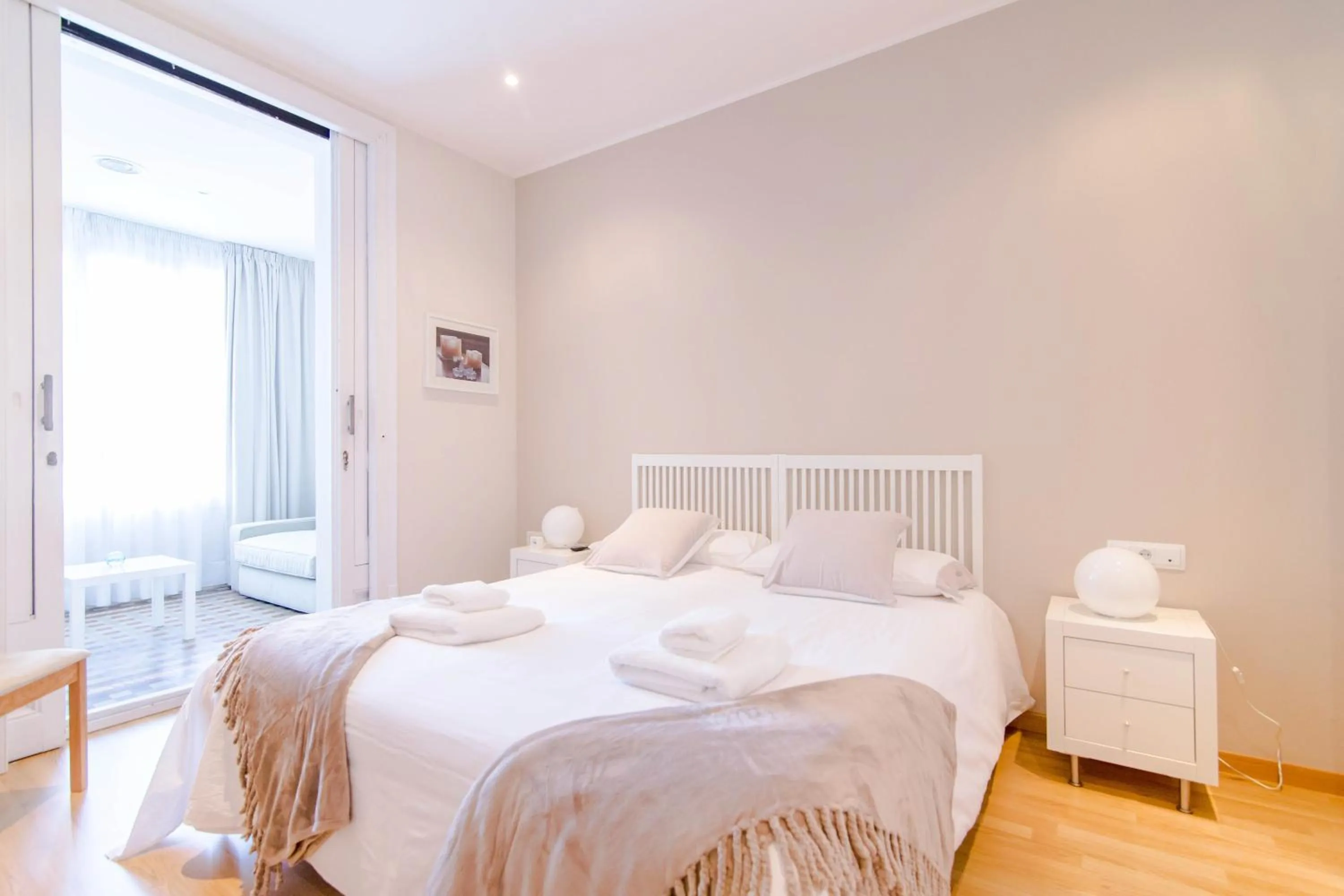 Bed in Pelayo Deluxe Apartments