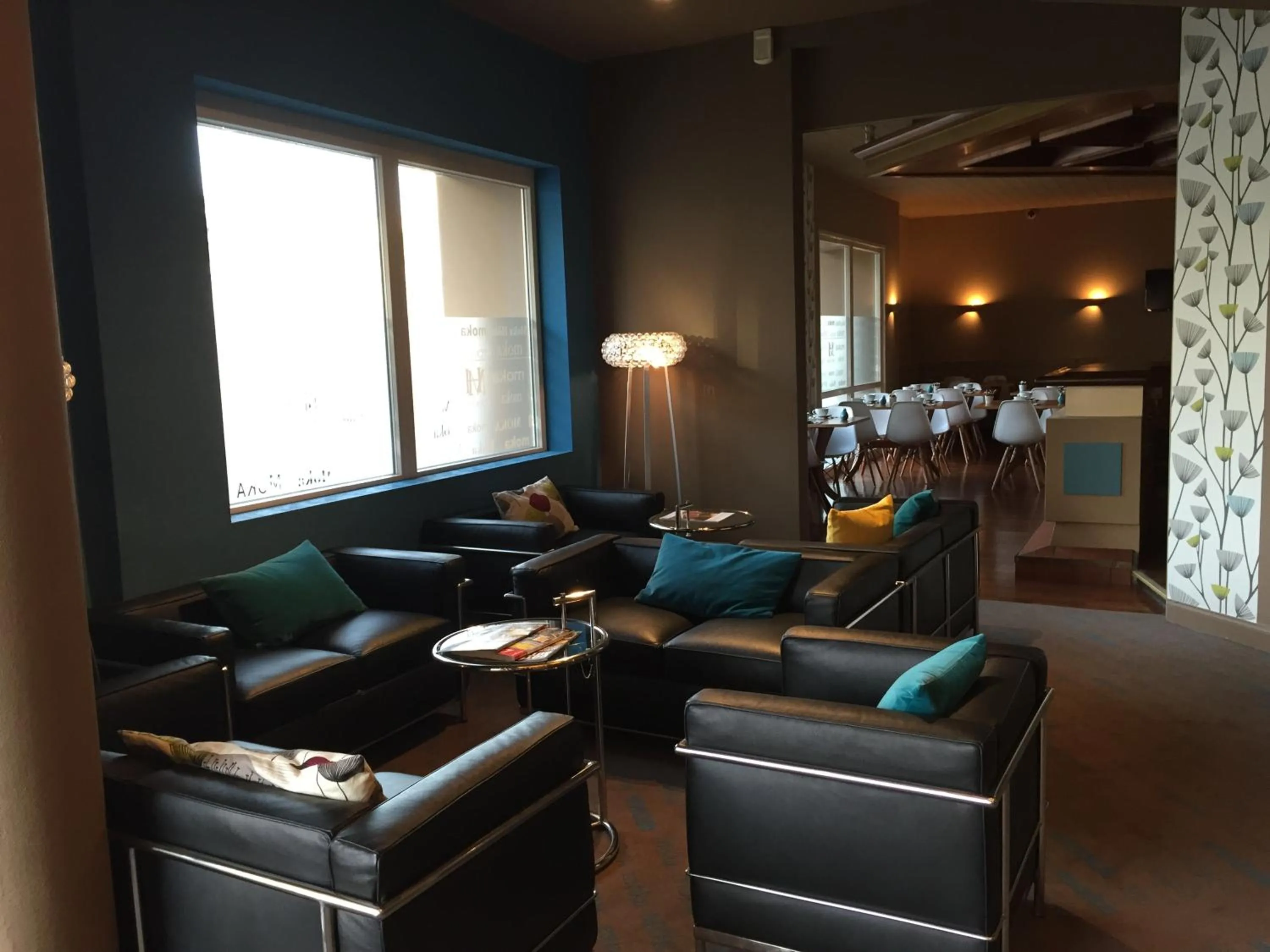 Communal lounge/ TV room in Moka Hotel