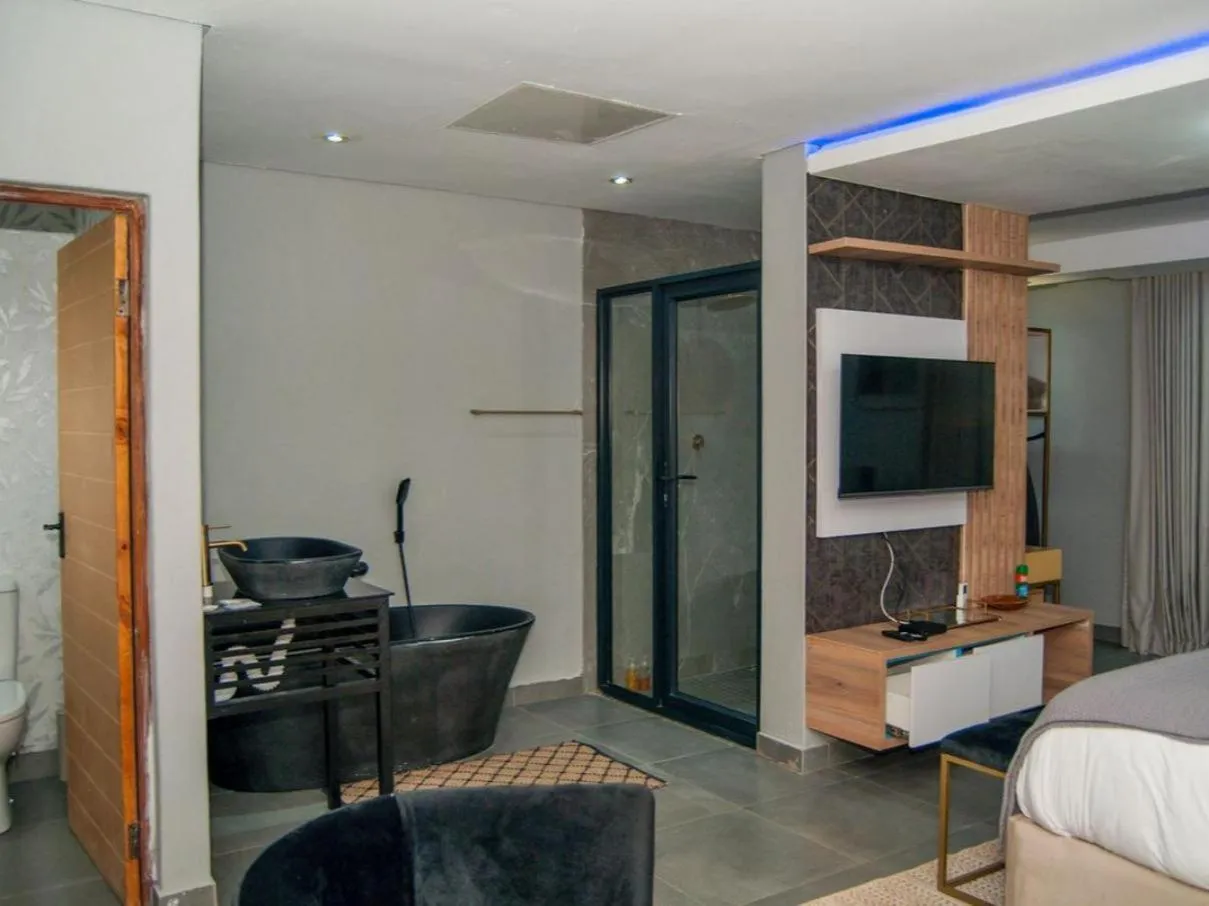 Shower, Bed in The Lux Hotel and Resorts