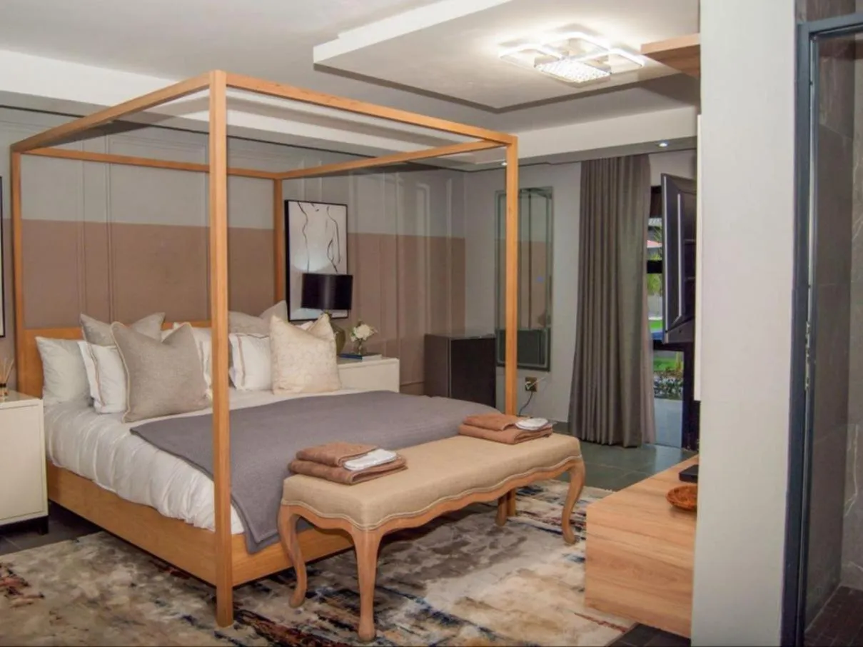 Bed in The Lux Hotel and Resorts