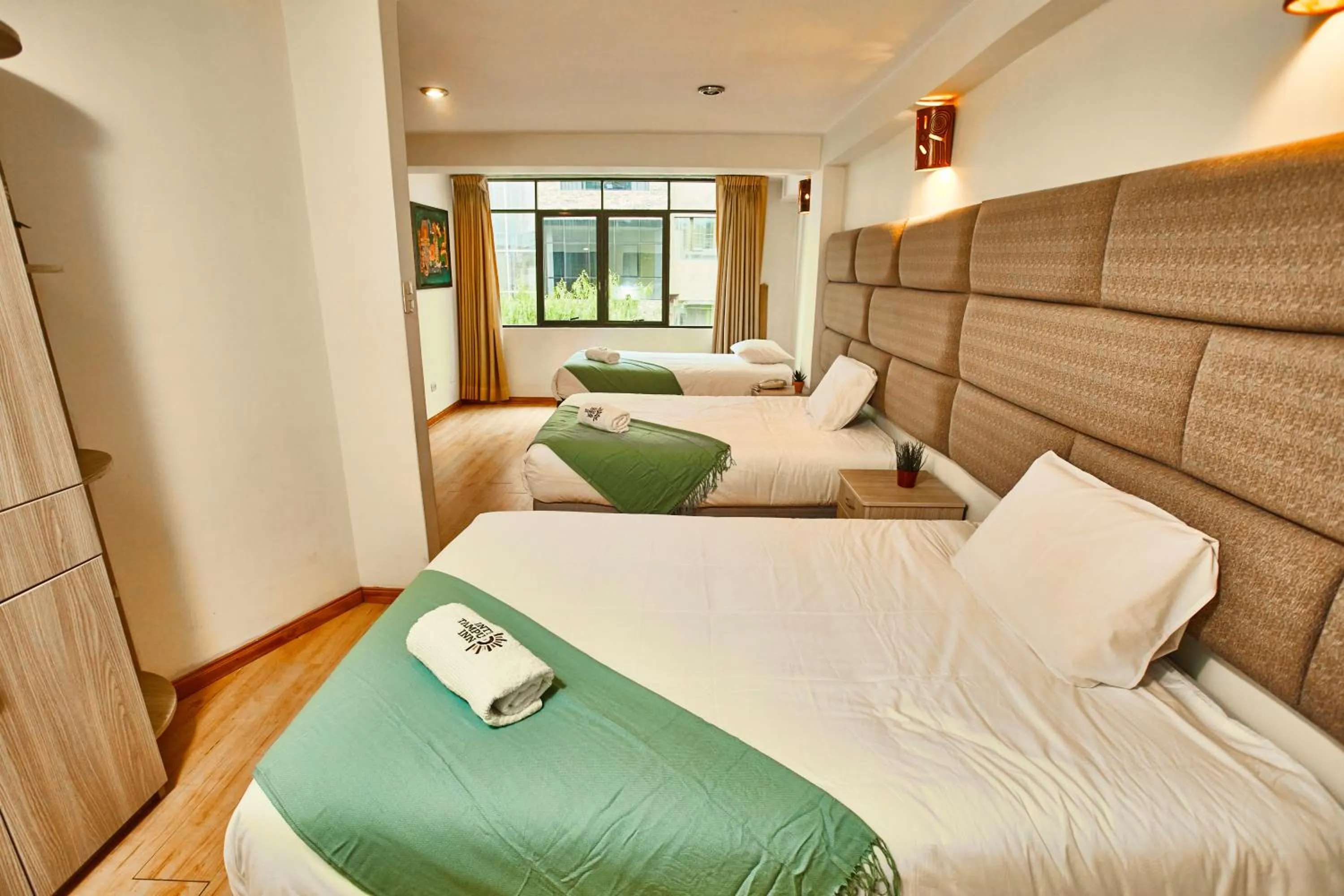 Bed in Inti Tampu Inn