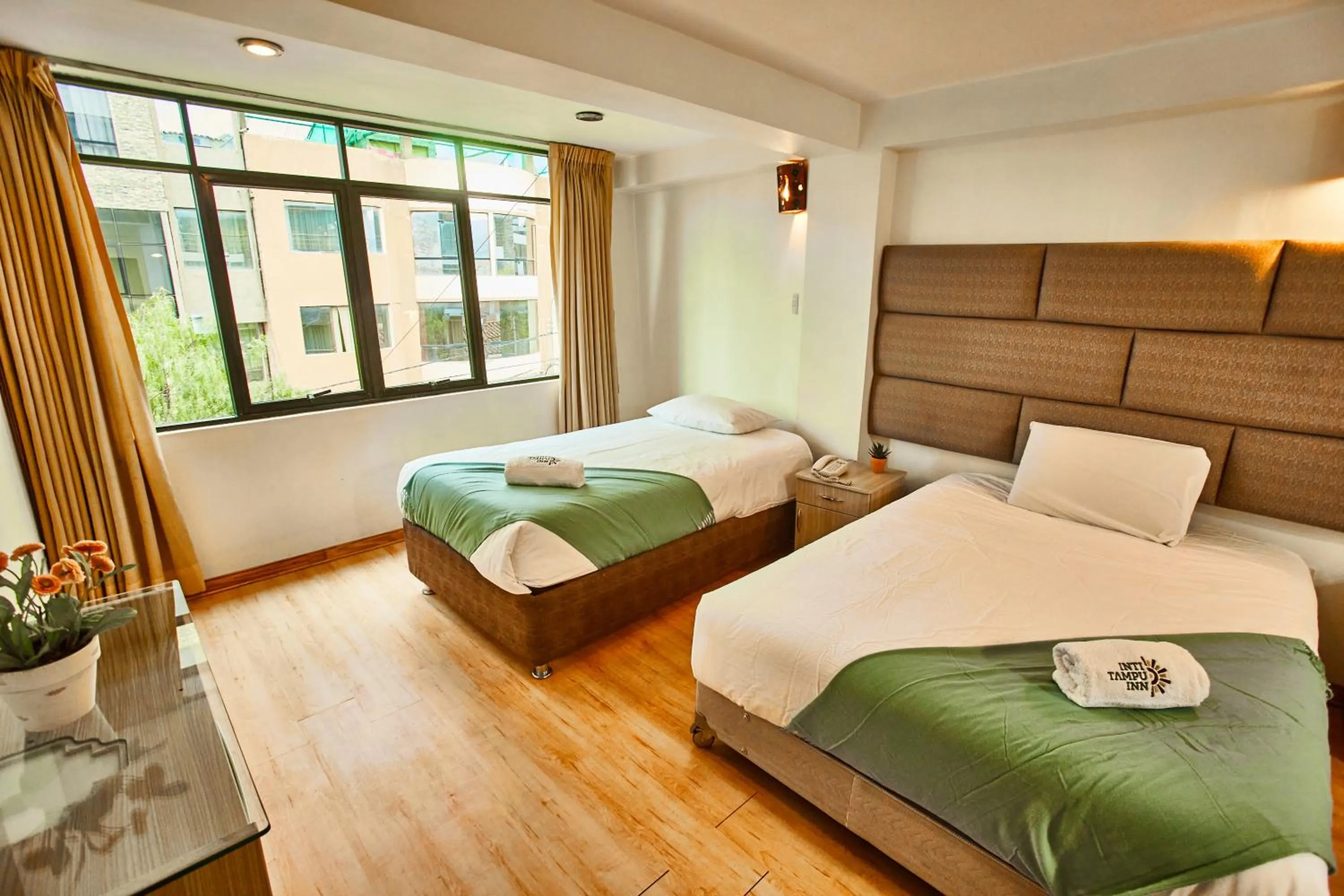 Bed in Inti Tampu Inn