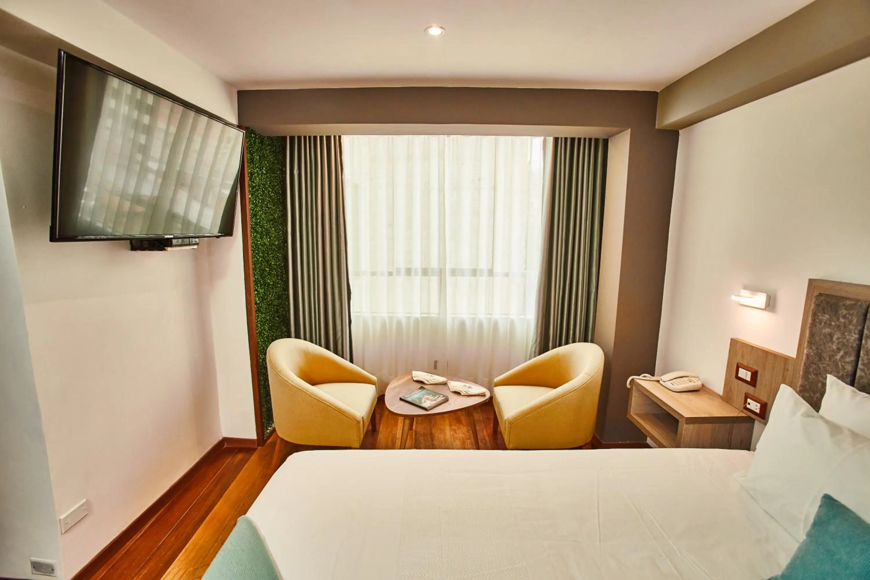 Bed in Inti Tampu Inn