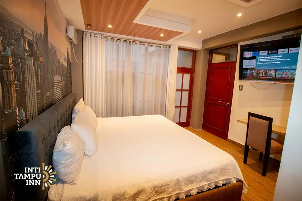 Bed in Inti Tampu Inn