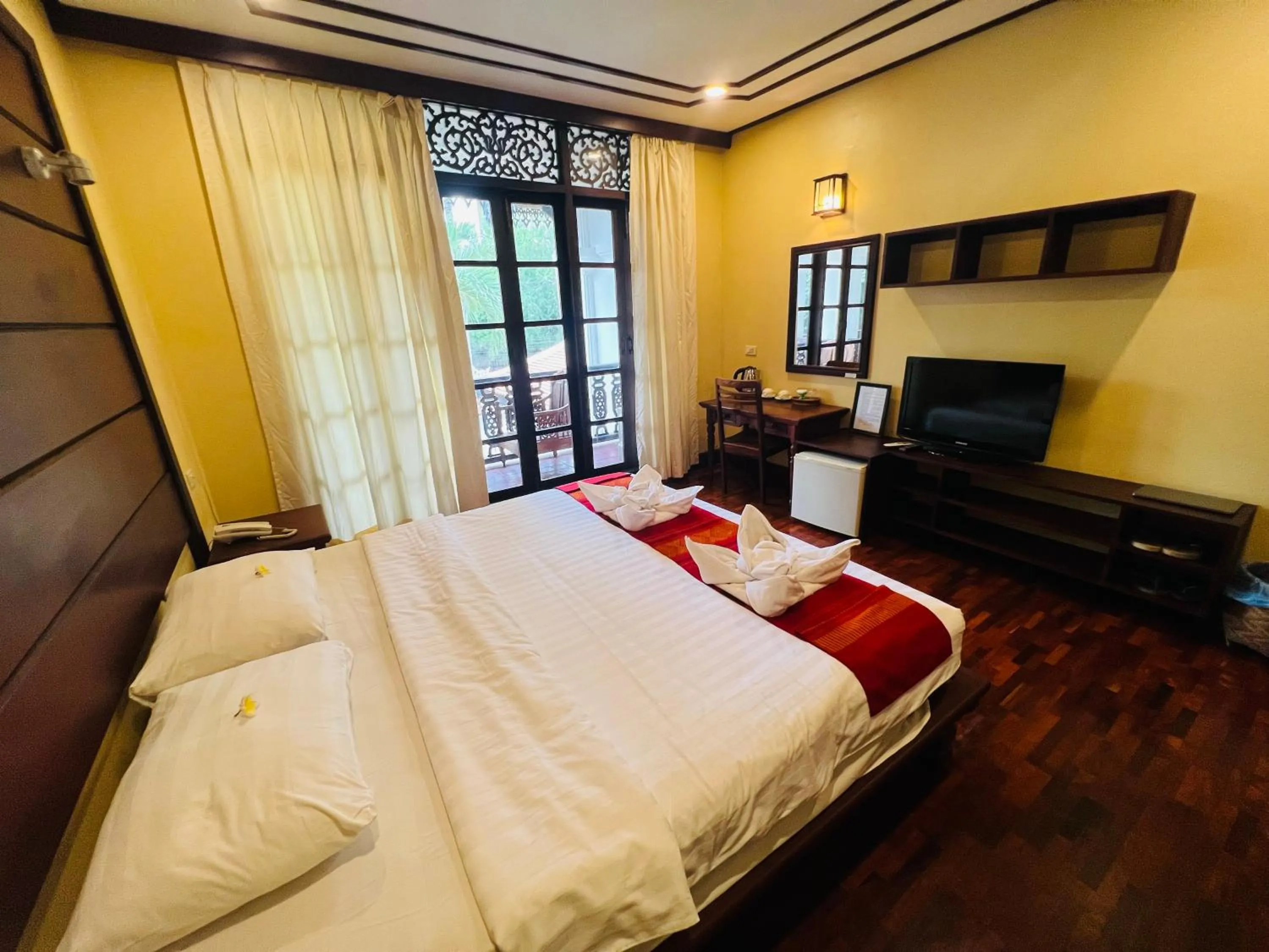 Bed in Meuangluang Hotel