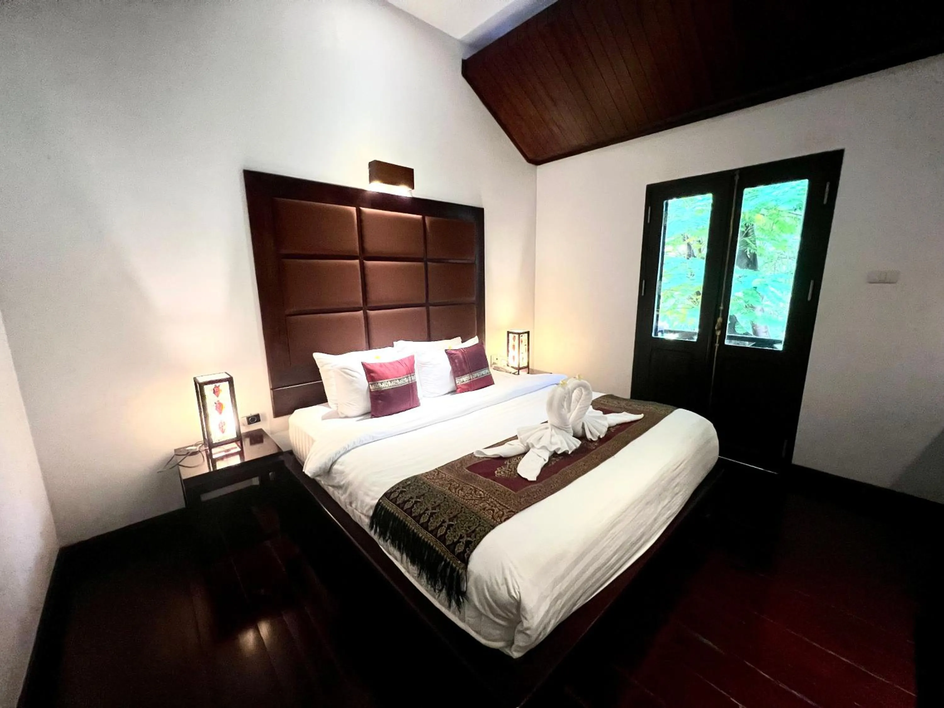 Bed in Meuangluang Hotel